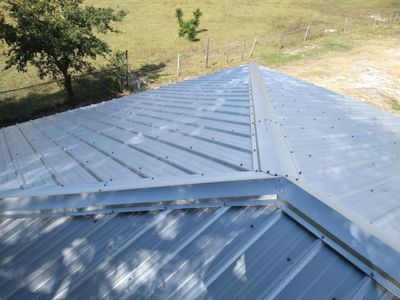 Residential Roofing Installation using 26 GA Rib Panel Galvalume 