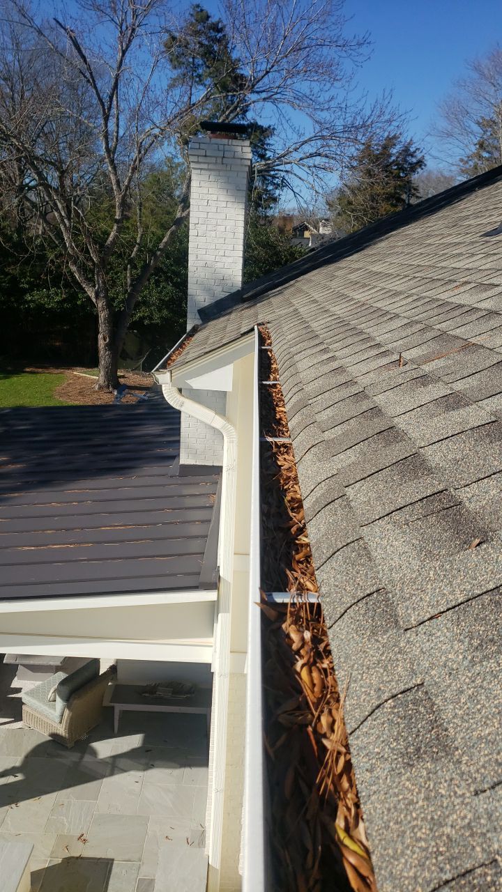 Sara Gutter cleanout using water by Power Wash Masters LLC