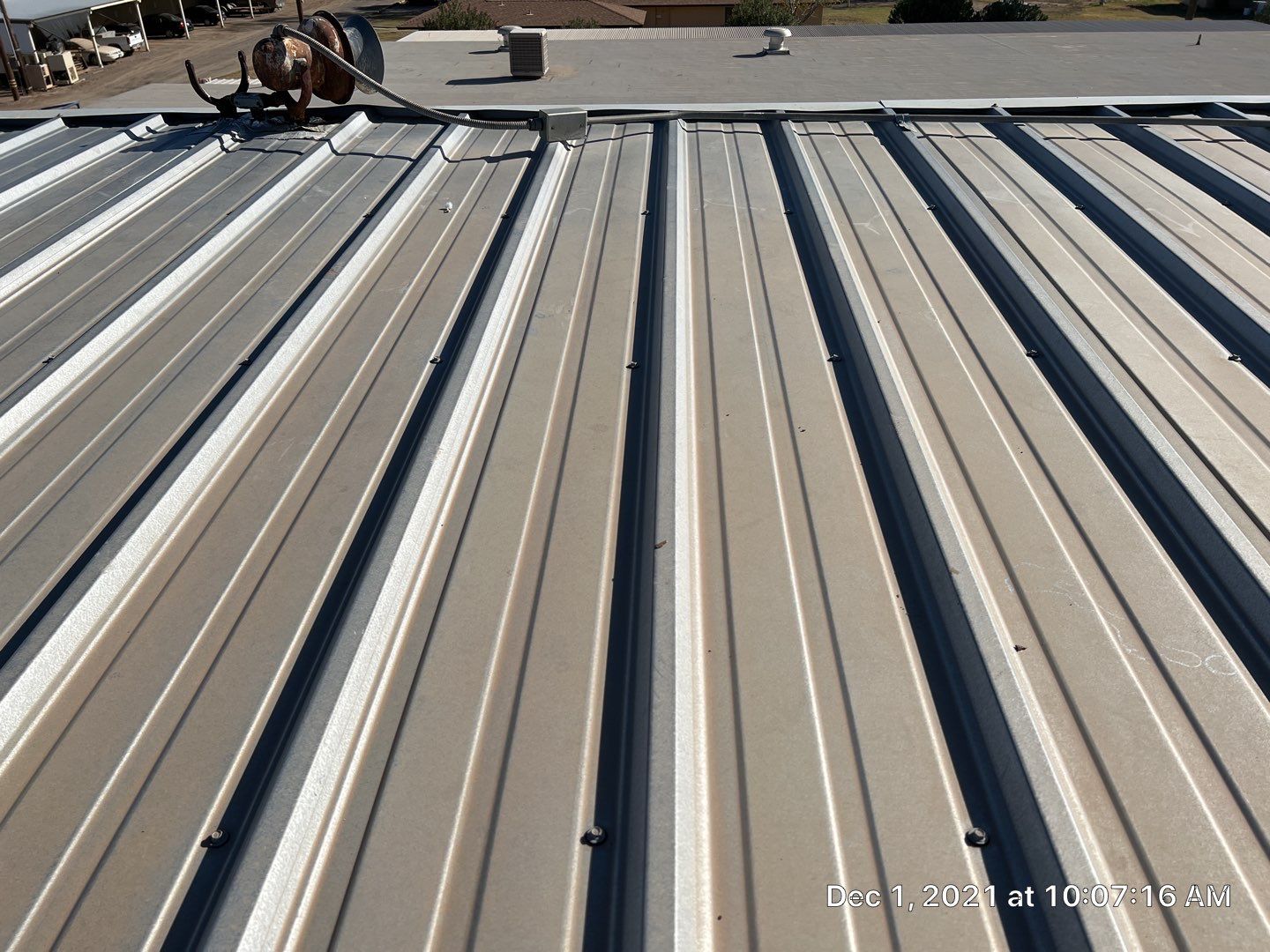 Metal roof restoration on commercial roof using Conklin Benchmark/PUMA XL fabric and coating by Straight Edge Roofing Inc