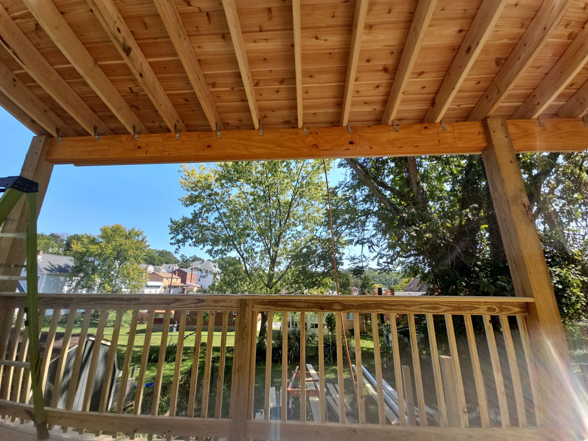 Deck and shed roof by Cousins Roofing Siding & Decks