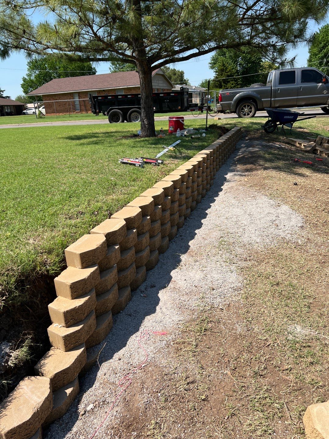 Retaining Wall using Rocks by Clays Services Inc