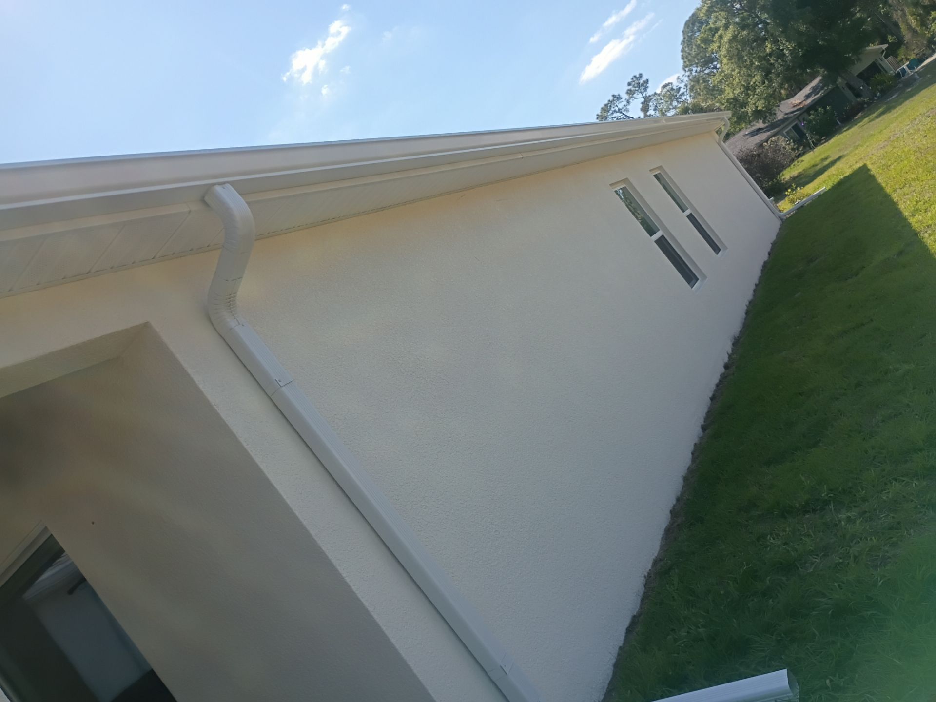 6-inch K-style White Seamless Gutters with Downspouts in North Port, FL by Gutter Professors