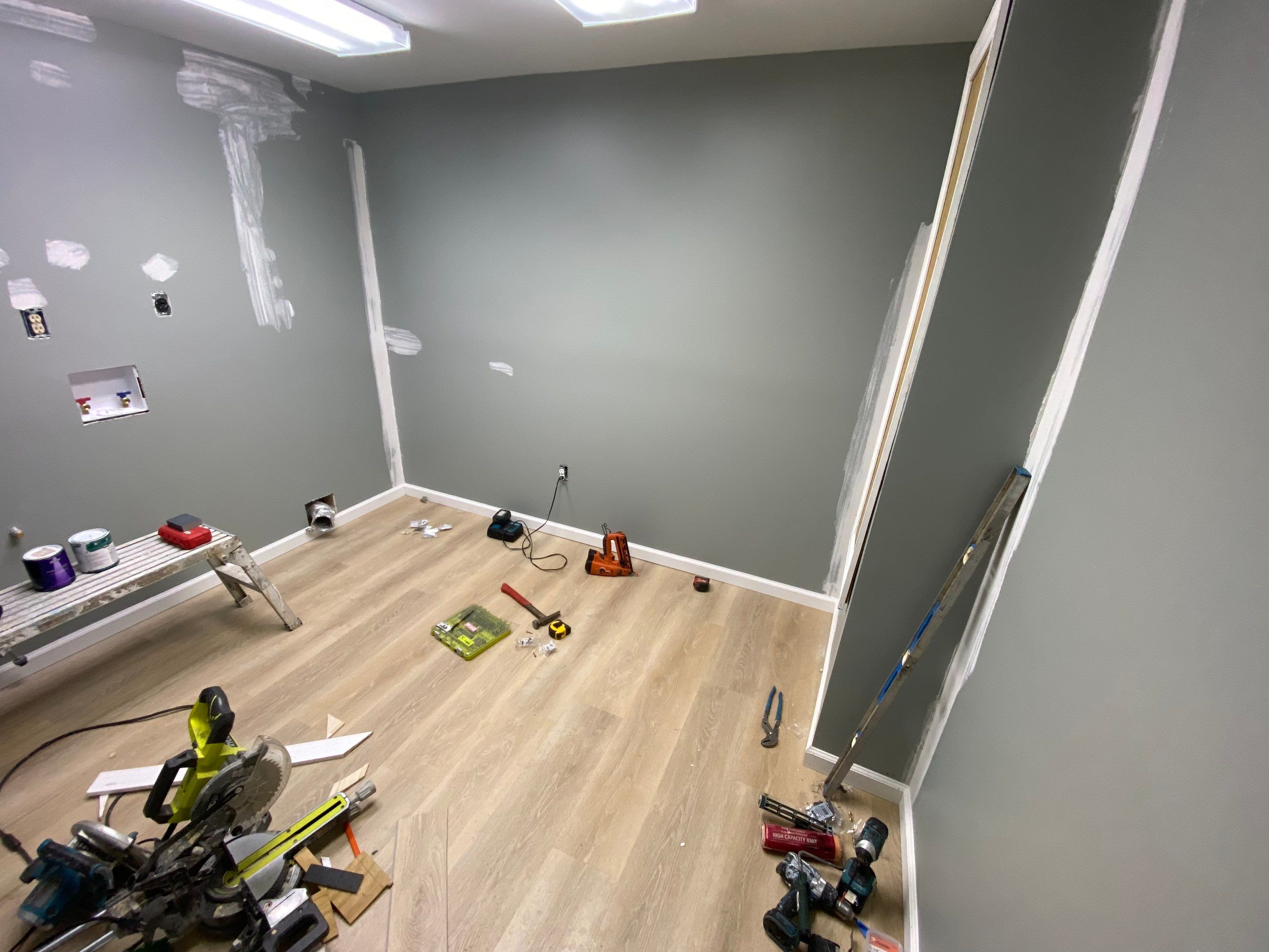 Laundry Room Redmodel using Lifeproof Luxury Vinyl Plank Flooring by The Smet Companies, LLC