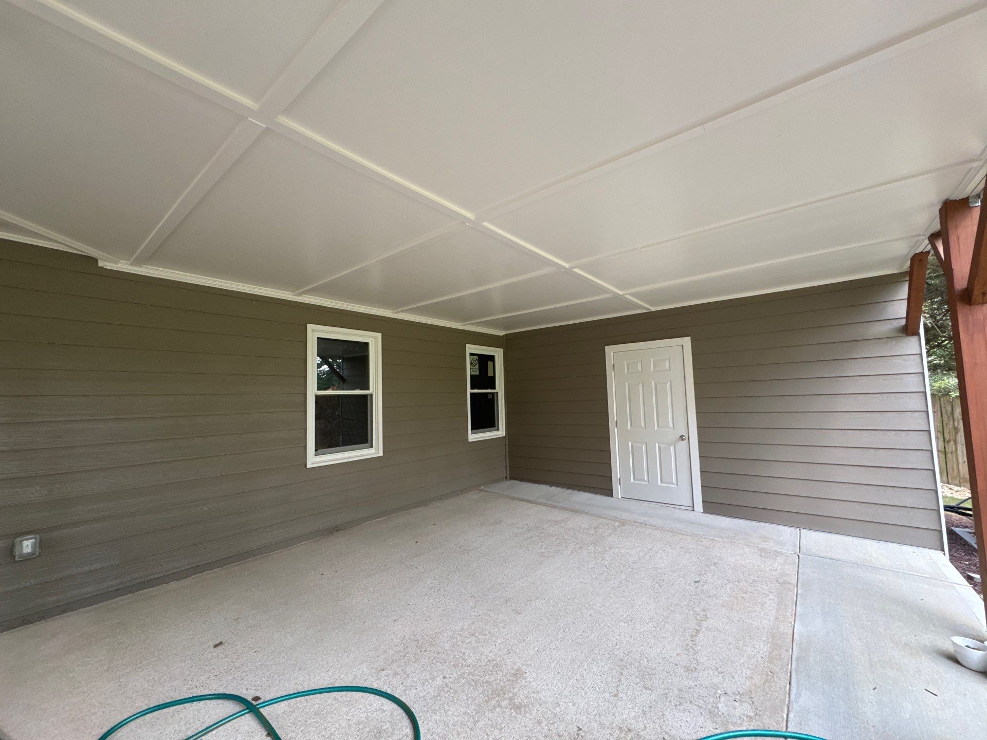 Exterior Modernization Featuring New Siding and Custom Wood Portico by Swift Home Renovations