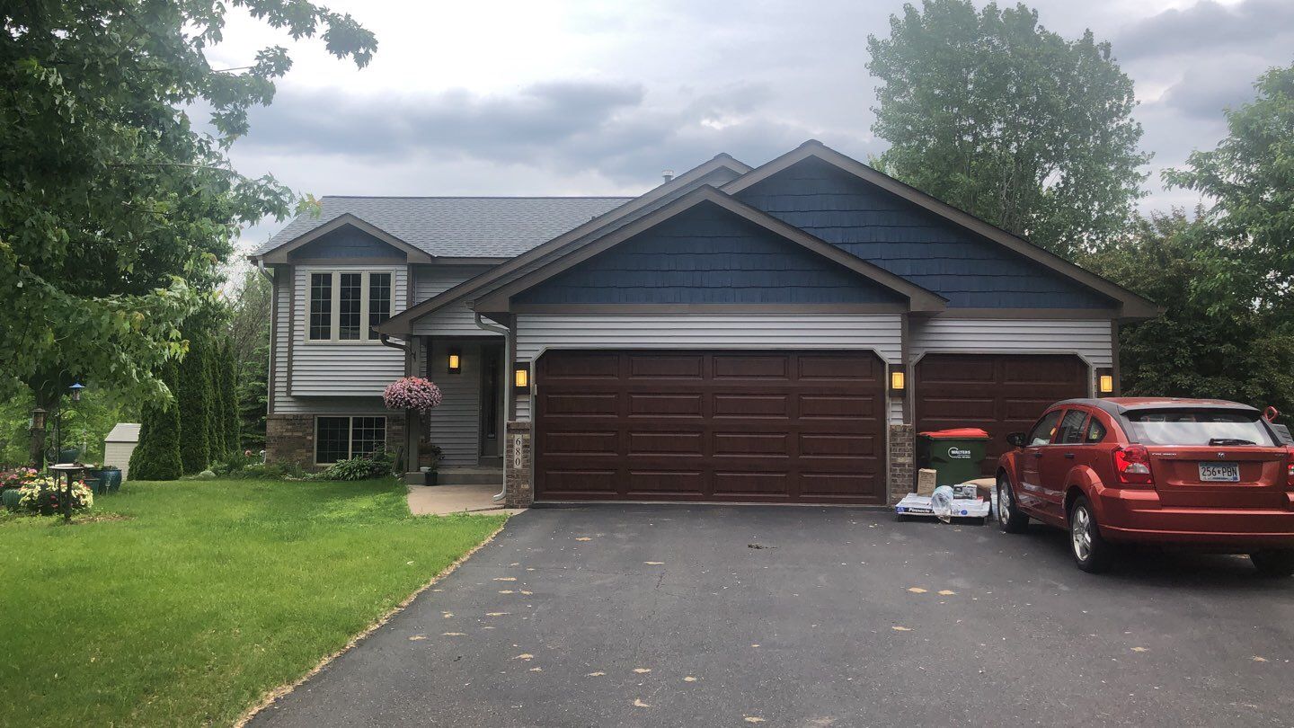 Storm Damage Restoration using Atlas Pinnacle Shingles and Mastic Vinyl Siding  by MODERN EXTERIOR SYSTEMS