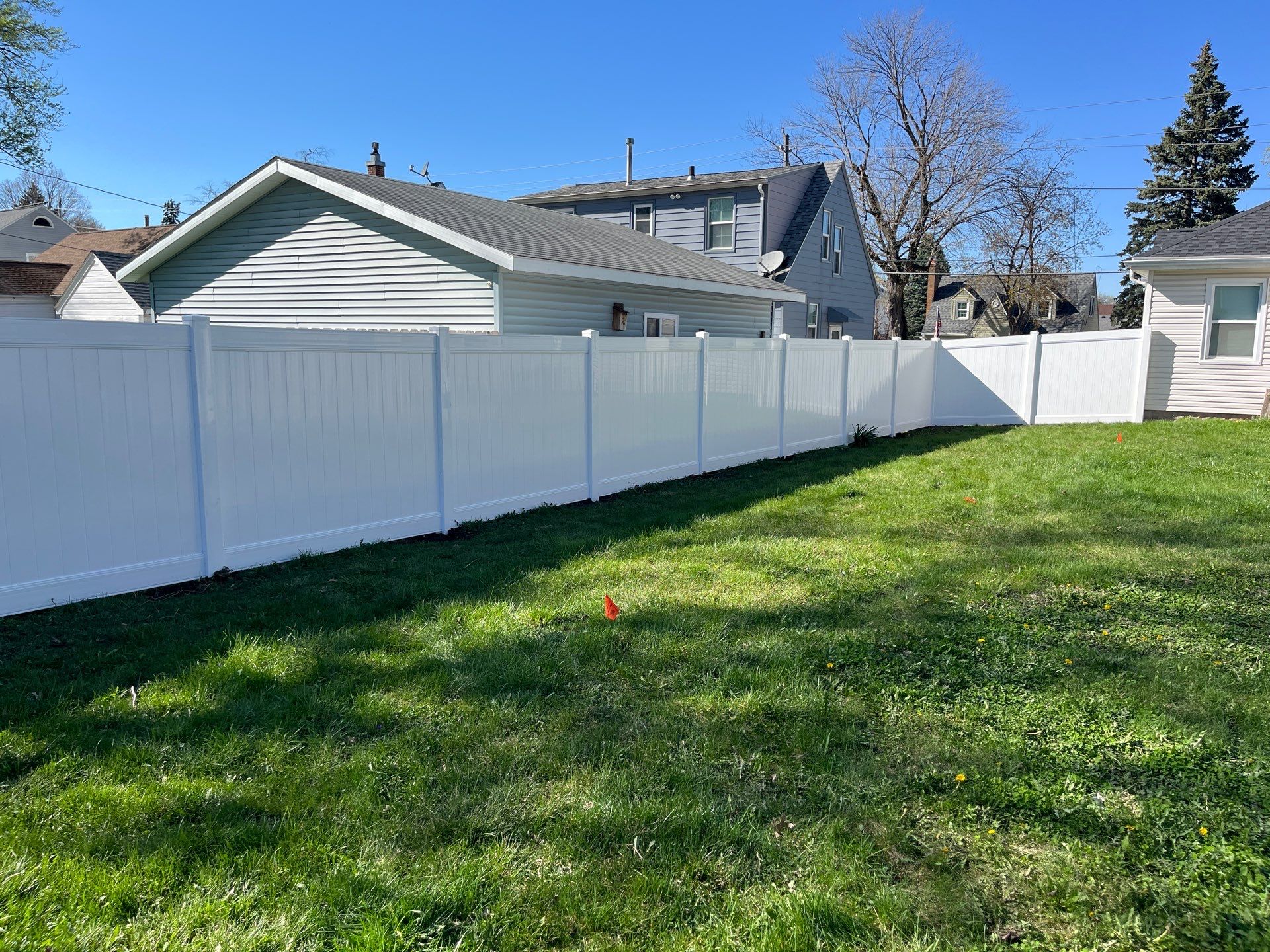 Residential White Vinyl Privacy Fence Installation in Waterloo, Iowa by Perfect Picket Fence and Stain