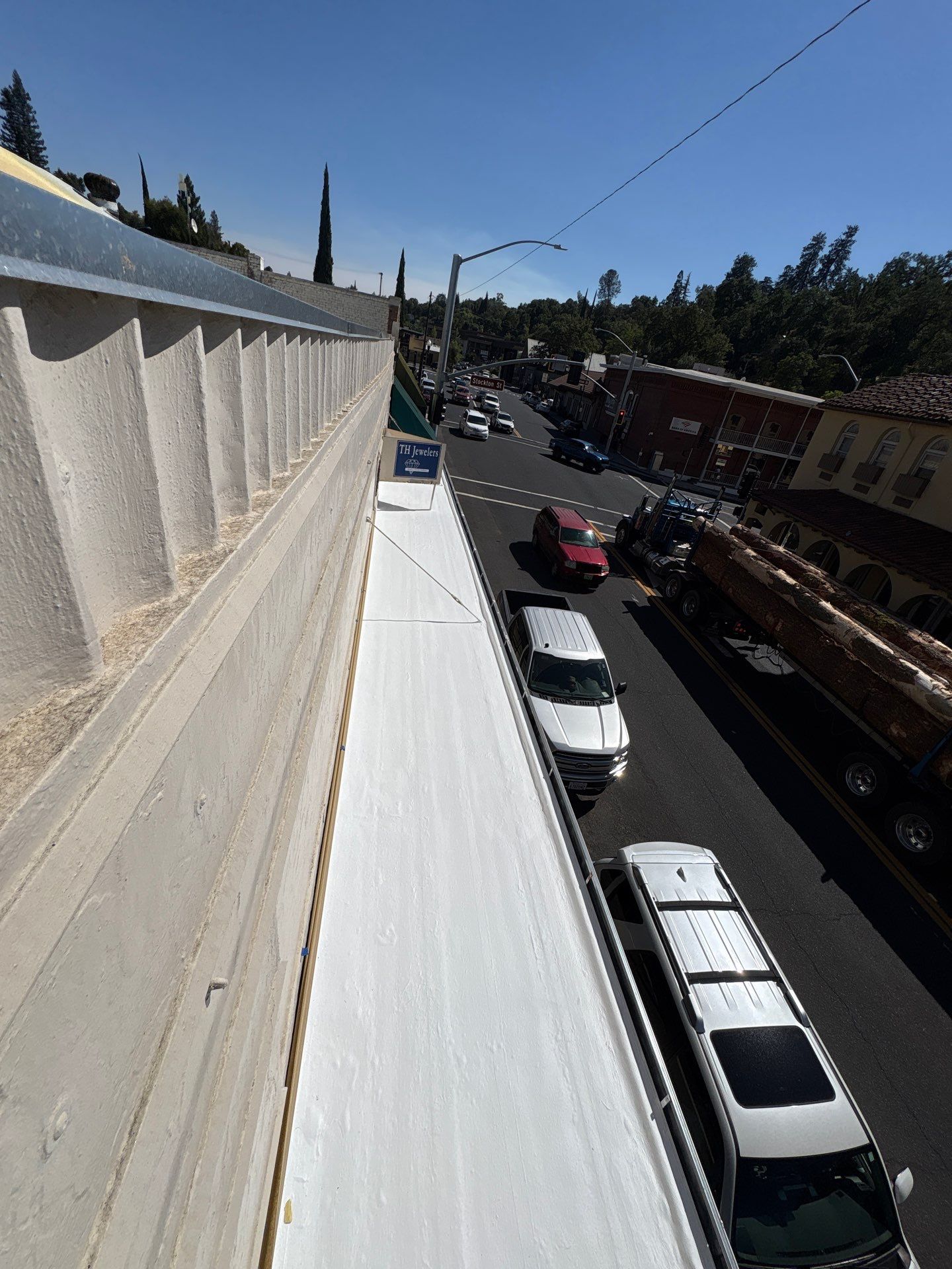 Foam and coatings on commercial roof by Straight Edge Roofing Inc