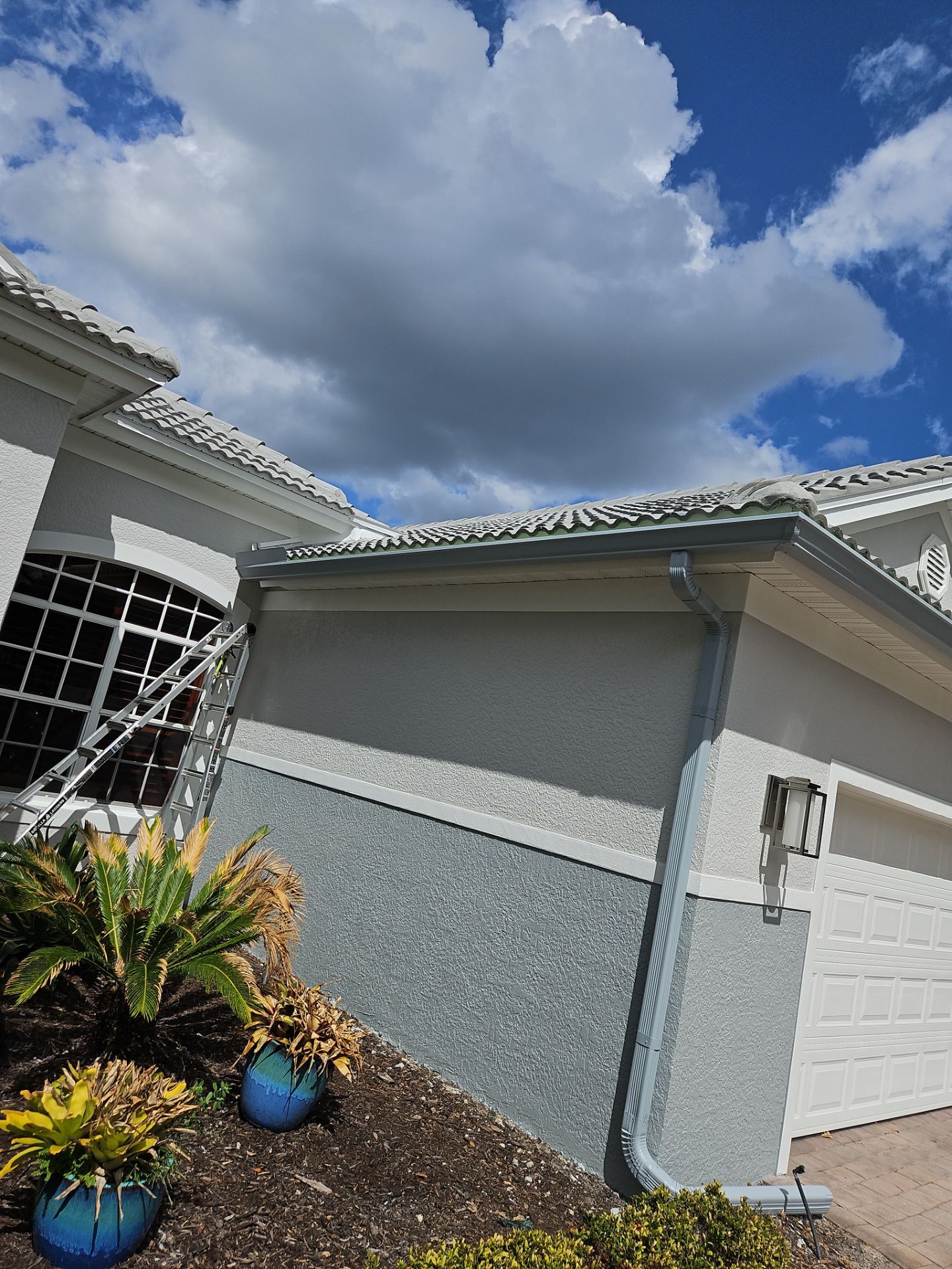 6-inch K-style Seamless Gutters and Splash Guard in Grey Color in Naples FL by Gutter Professors