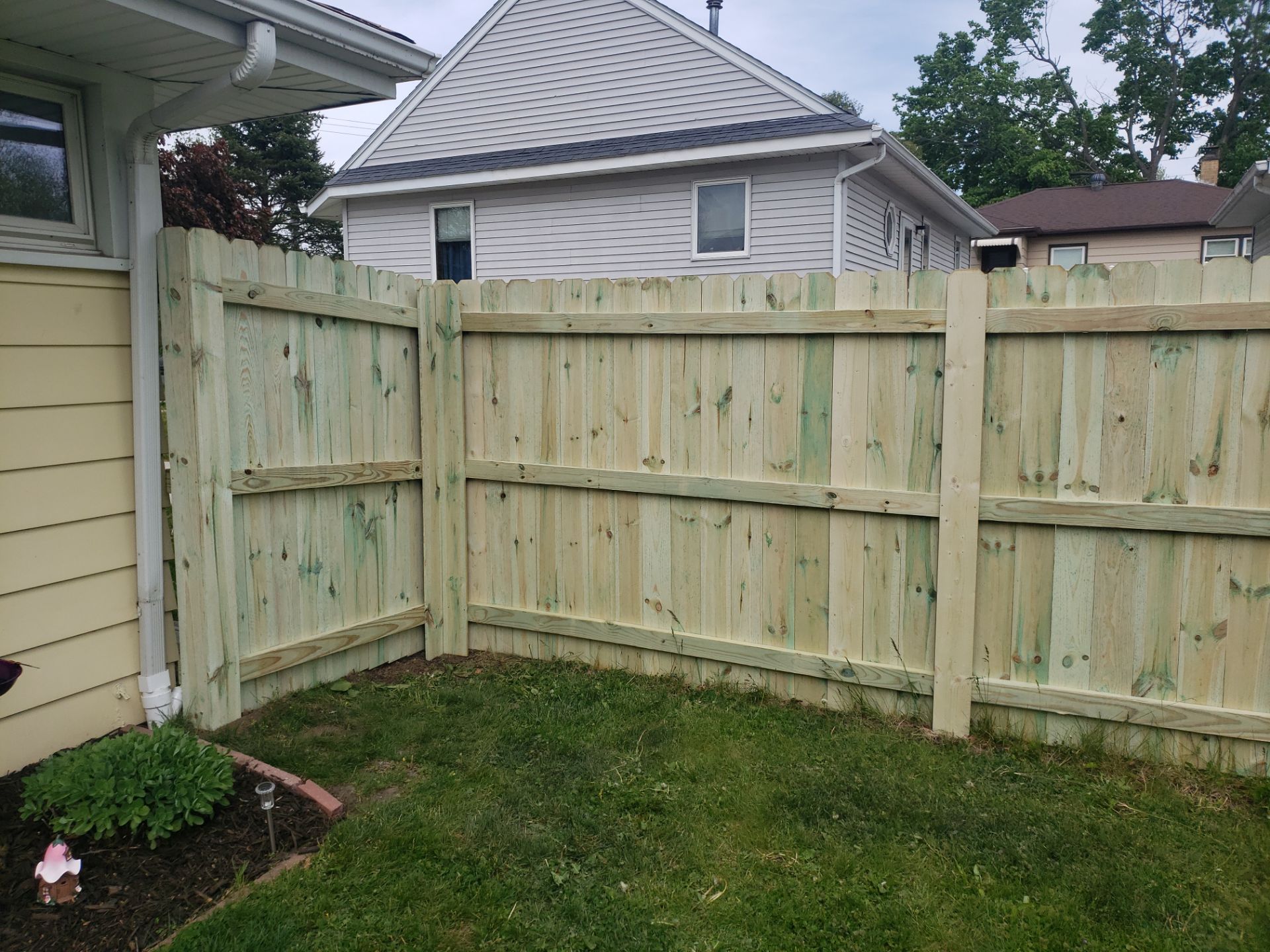 Pressure-Treated Wood Privacy Fence Installation in Waterloo by Perfect Picket Fence and Stain