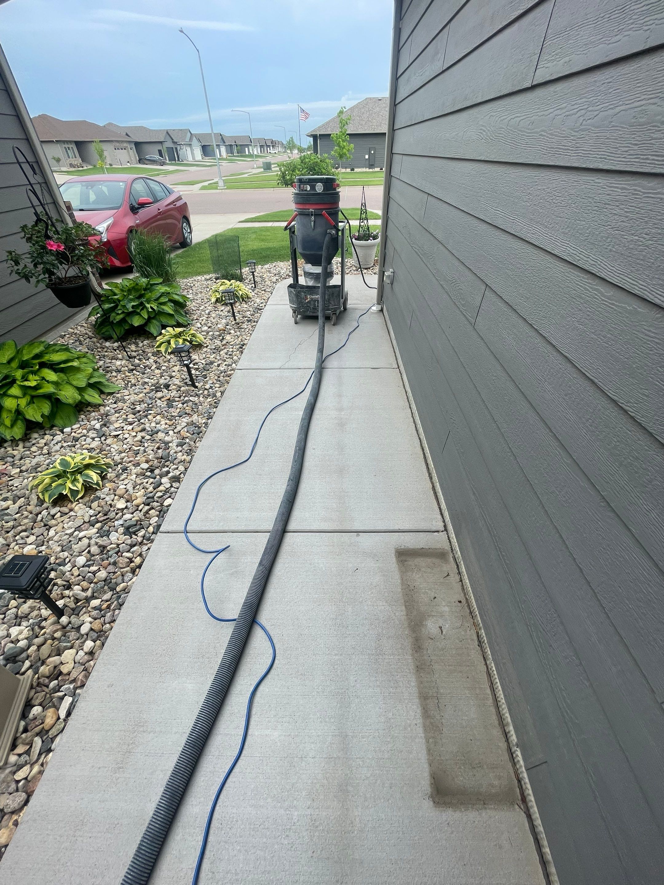 Custom Concrete Coating for Sioux Falls Patio and Front Walkway by Select Painting, Coatings & Garage Cabinets