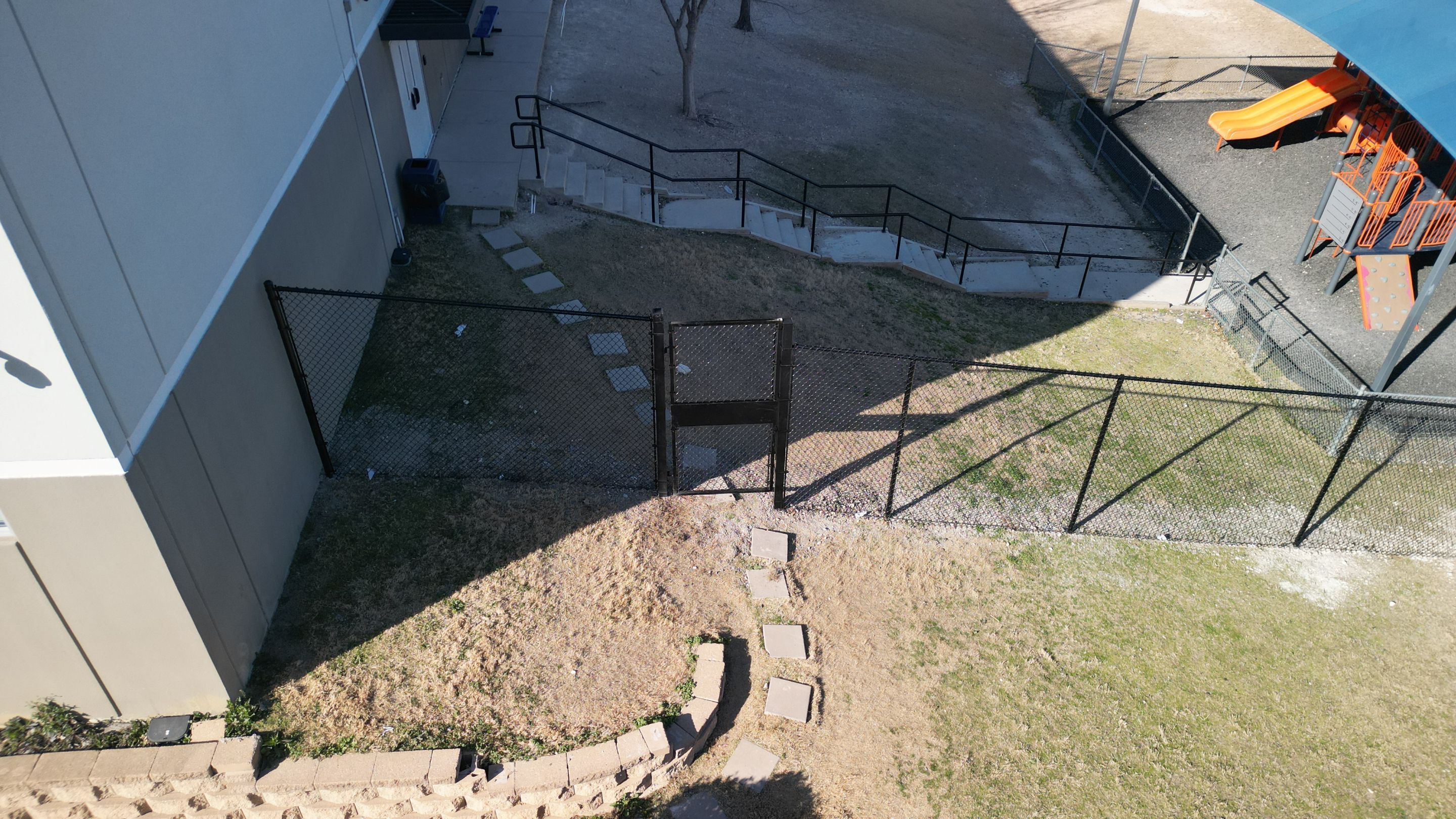 Commercial Fencing - Black vinyl coated Chain link Fence by 3:16 Roofing and Construction