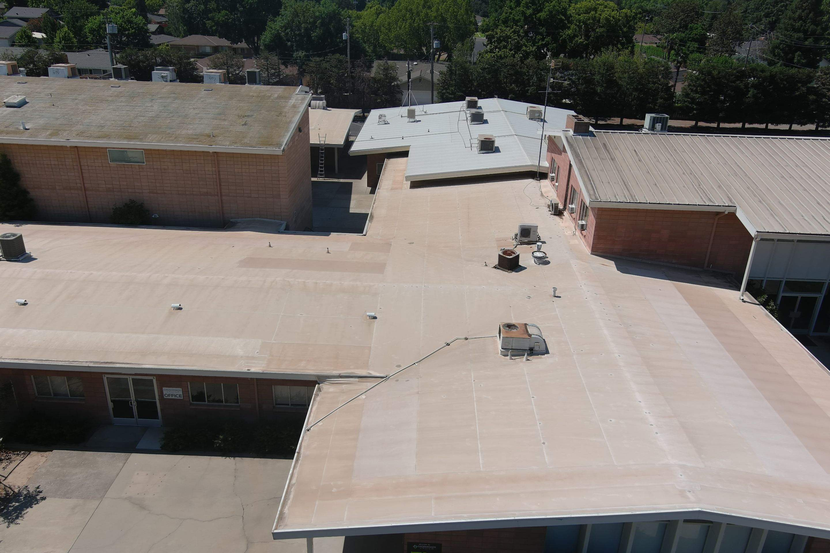MR Roofing system using Benchmark/PUMA XL coatings over TPO single-ply roofing by Straight Edge Roofing Inc