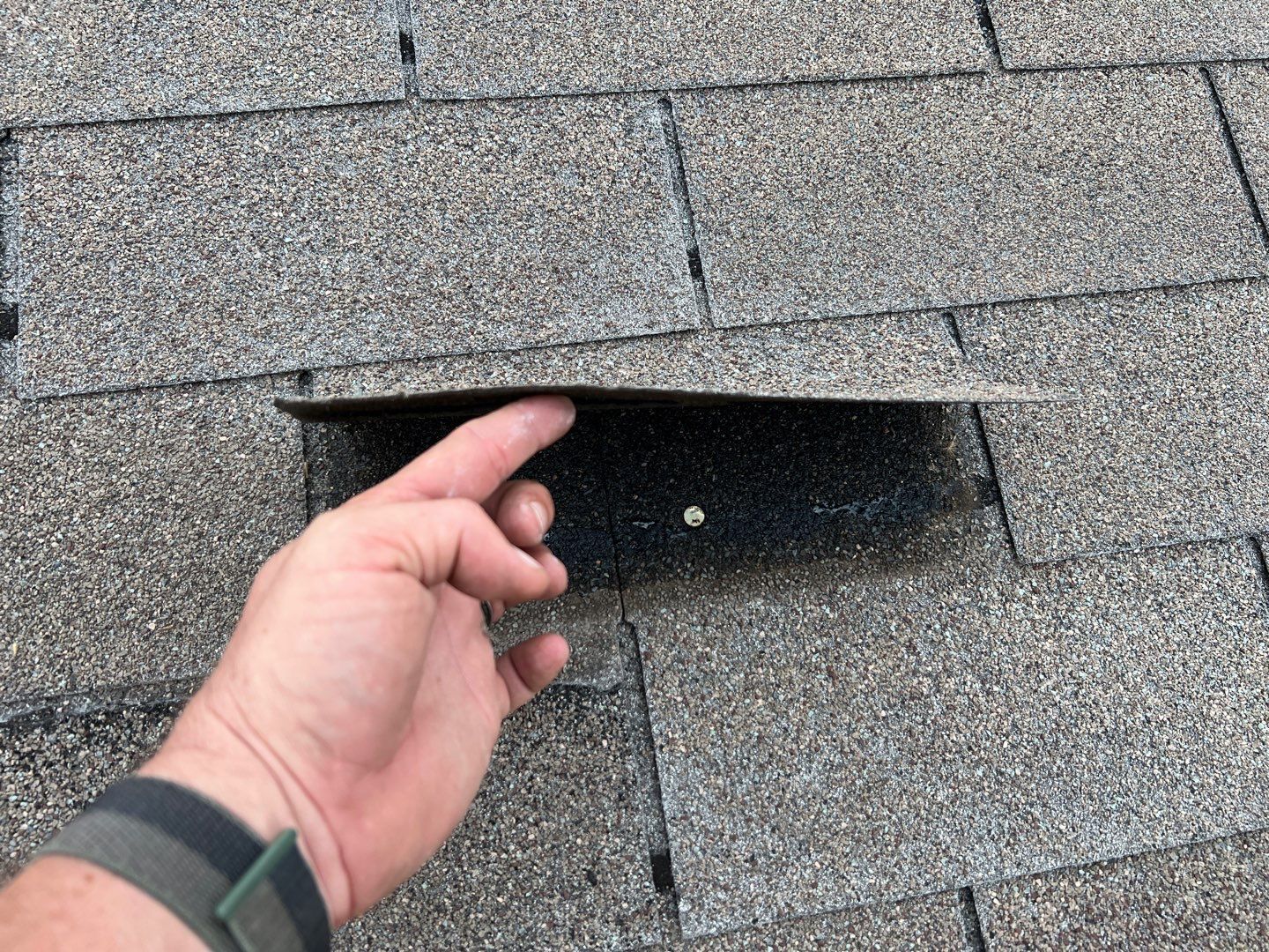 Wind damaged roof replacement by Oakwood Roofing and Construction, LLC