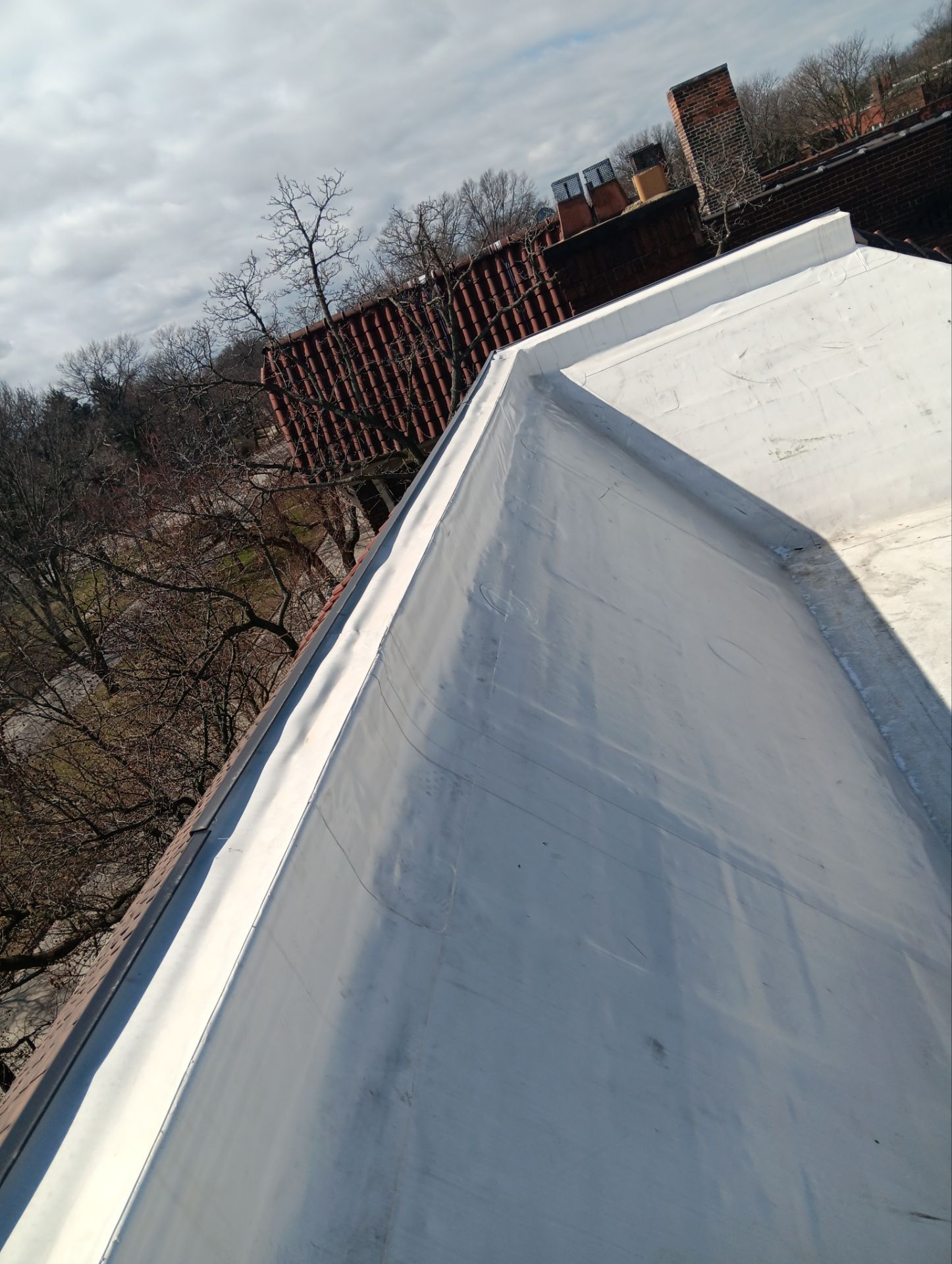 Commercial Roofing Installation using Duro-Last 50 mil PVC by 3 Daughters Construction 