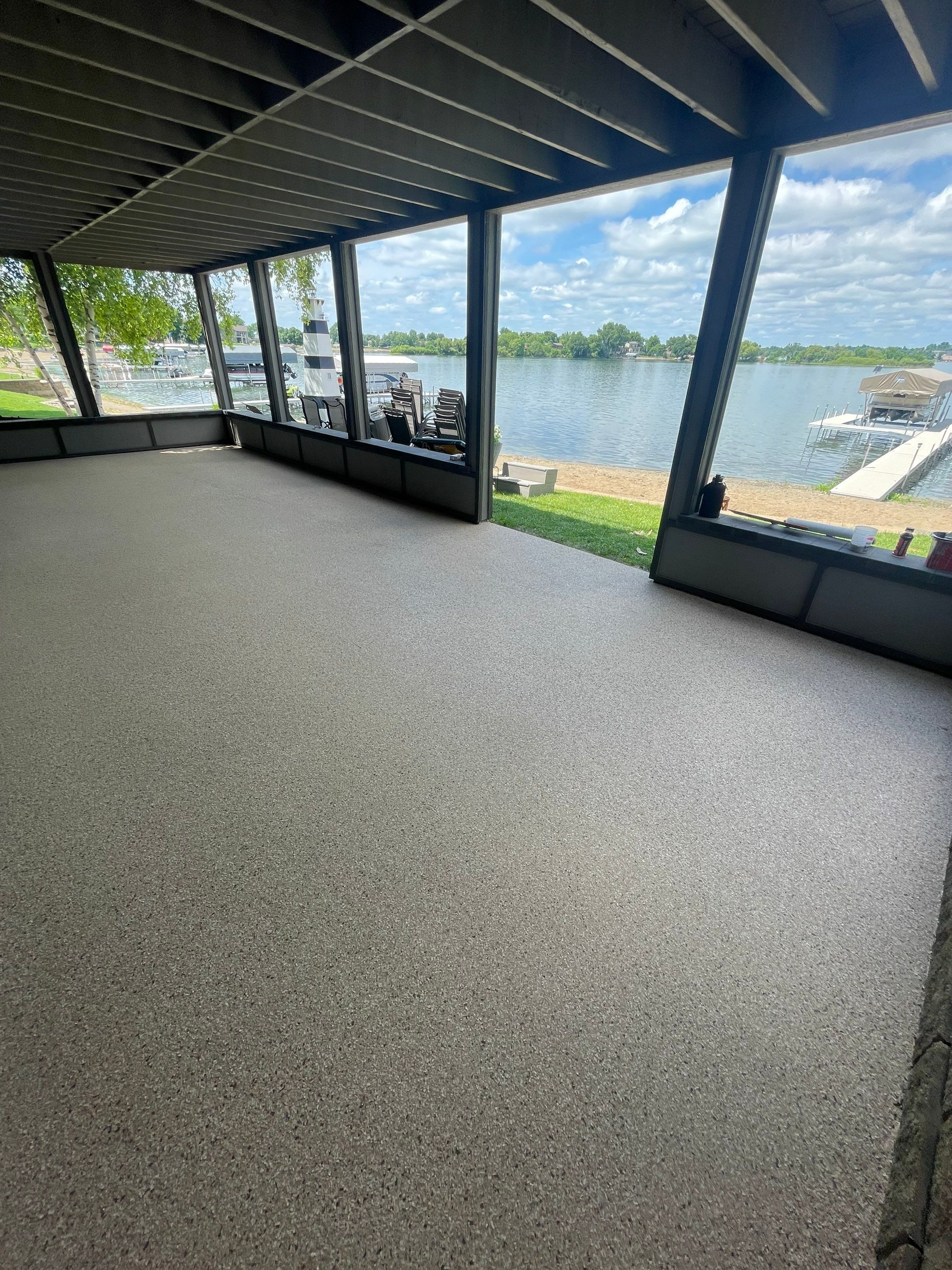 Lakefront Screened Patio Concrete Coating Installation in Wentworth by Select Painting, Coatings & Garage Cabinets
