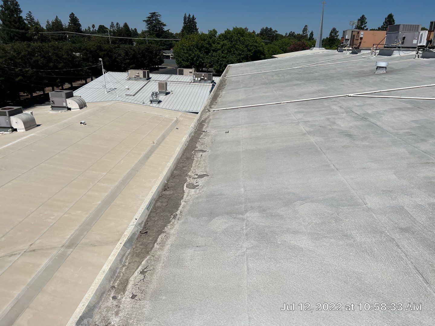 MR Roofing system using Benchmark/PUMA XL coatings over TPO single-ply roofing by Straight Edge Roofing Inc