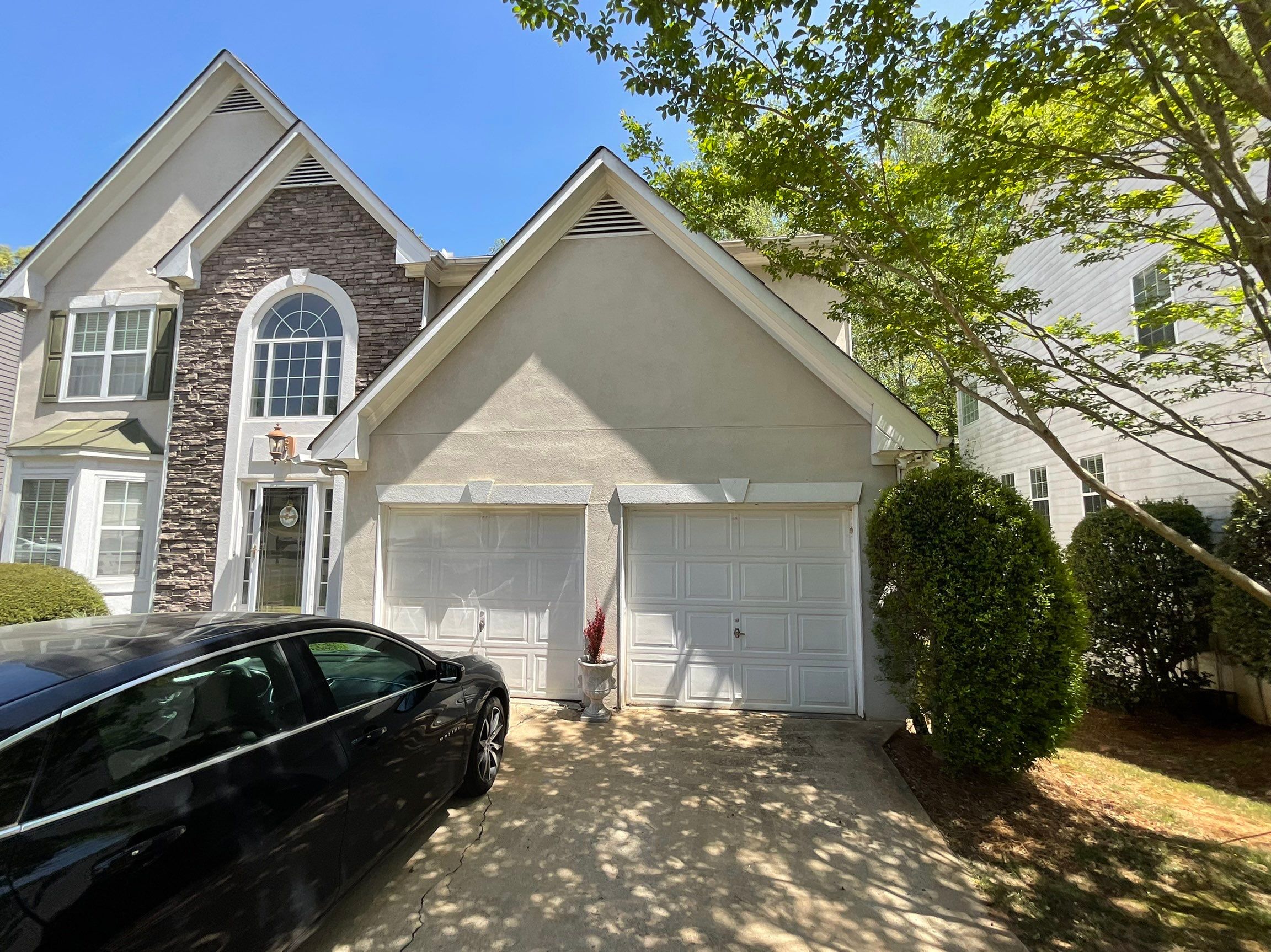 Stucco and Siding Exterior Painting with New Gutters in Kennesaw by Swift Home Renovations