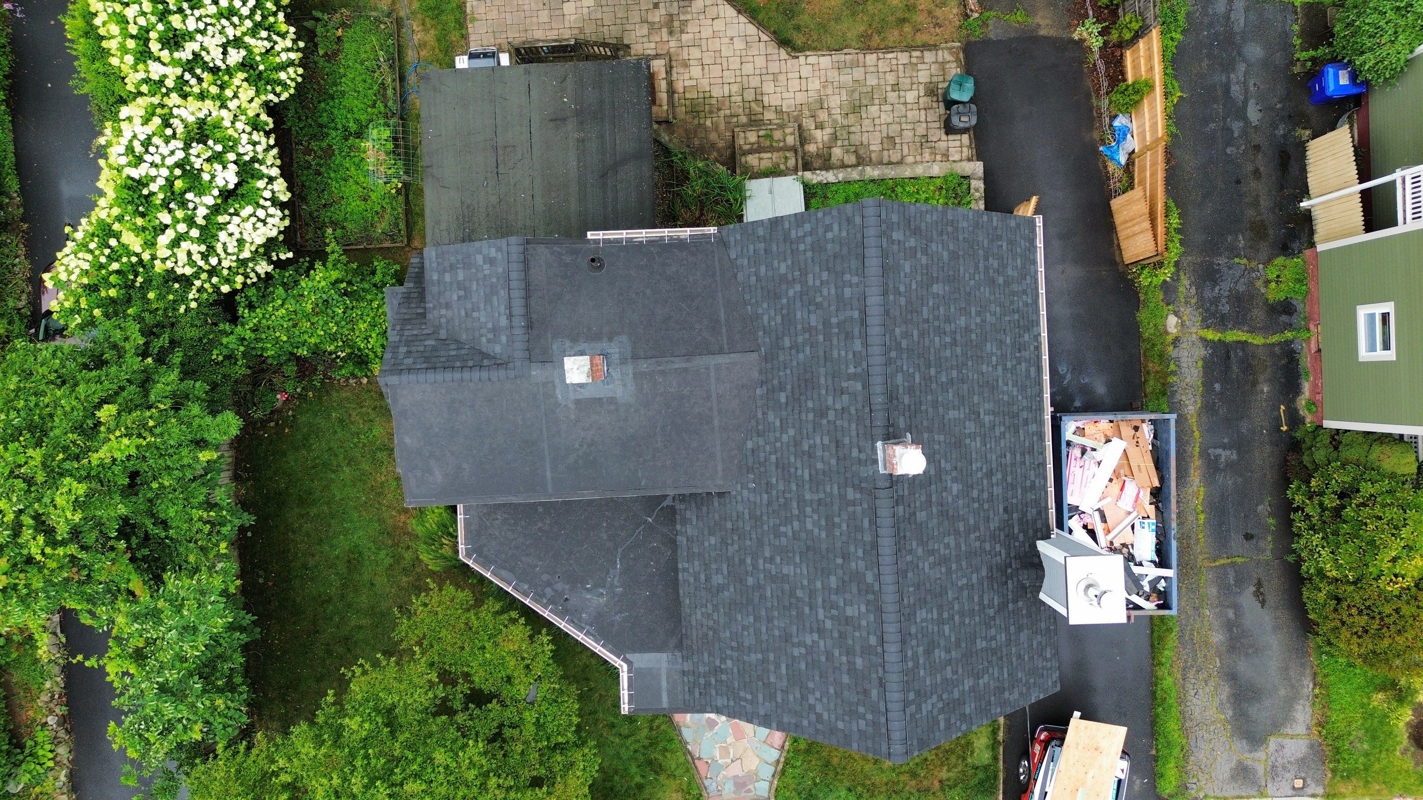 Full Roof Replacement + Custom Gutter Install | Onyx Black Finish by Mighty Dog Roofing of Greater Middlesex County