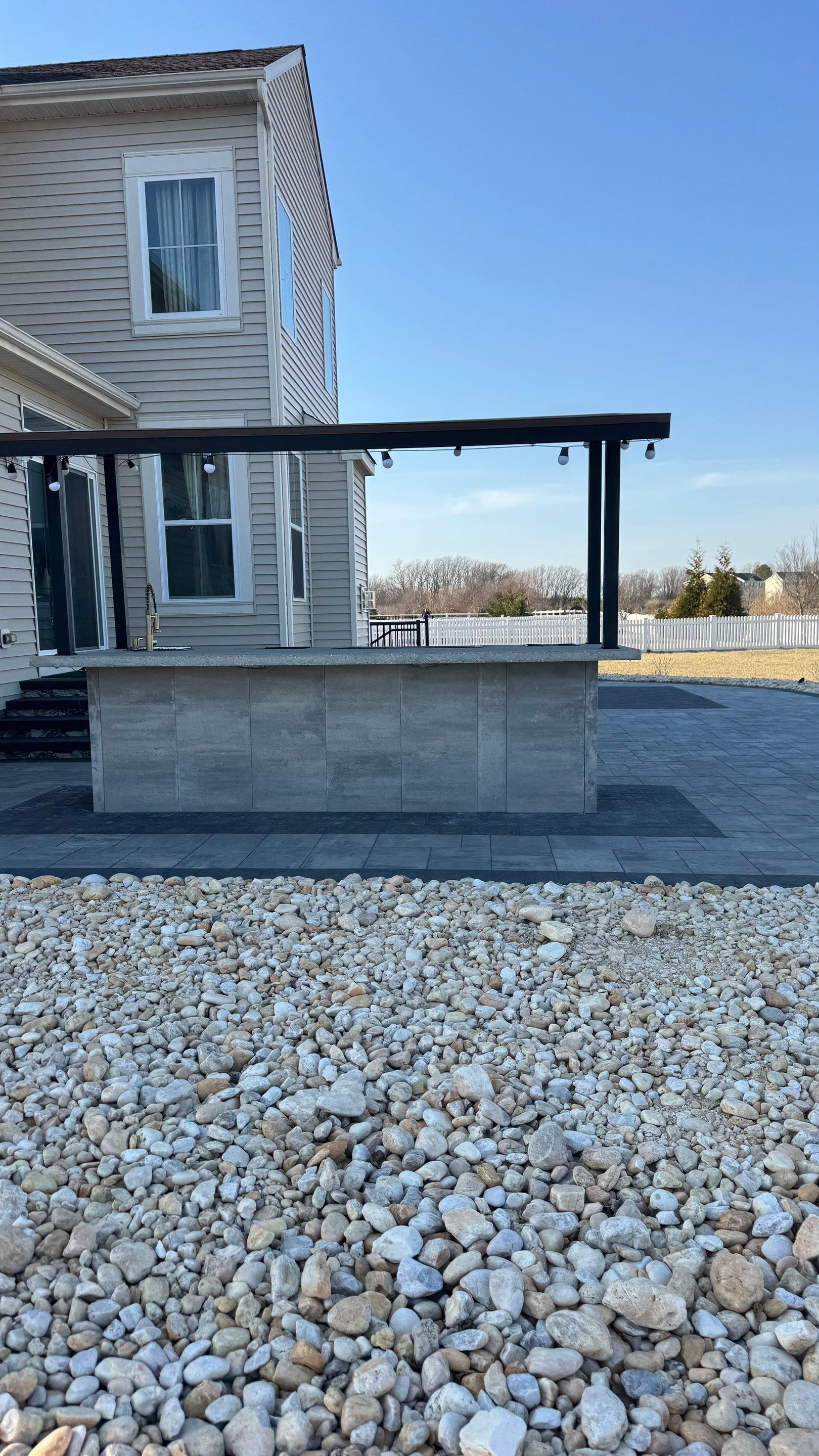 Custom Belgard patio by Studio G Indoor Spaces & Outdoor Living