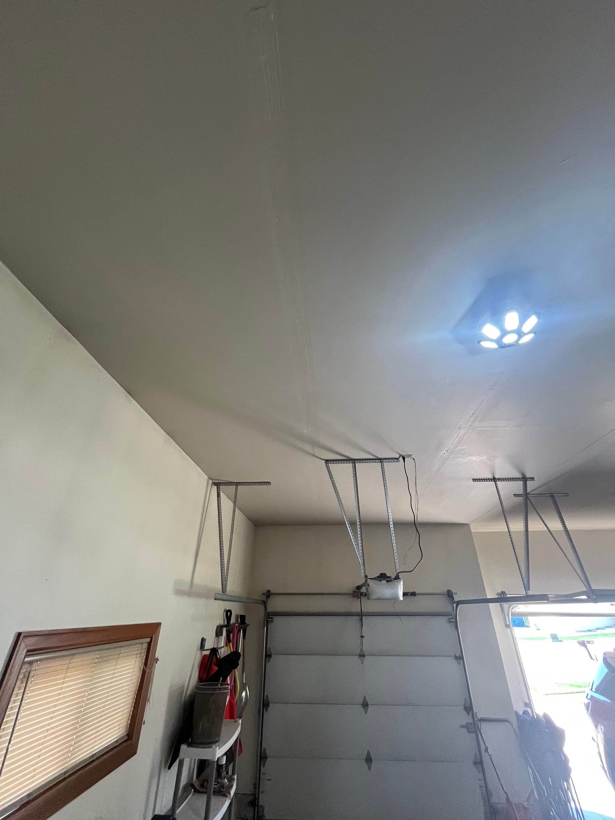 Residential Garage Interior Painting and Drywall Repair in Tea by Select Painting, Coatings & Garage Cabinets