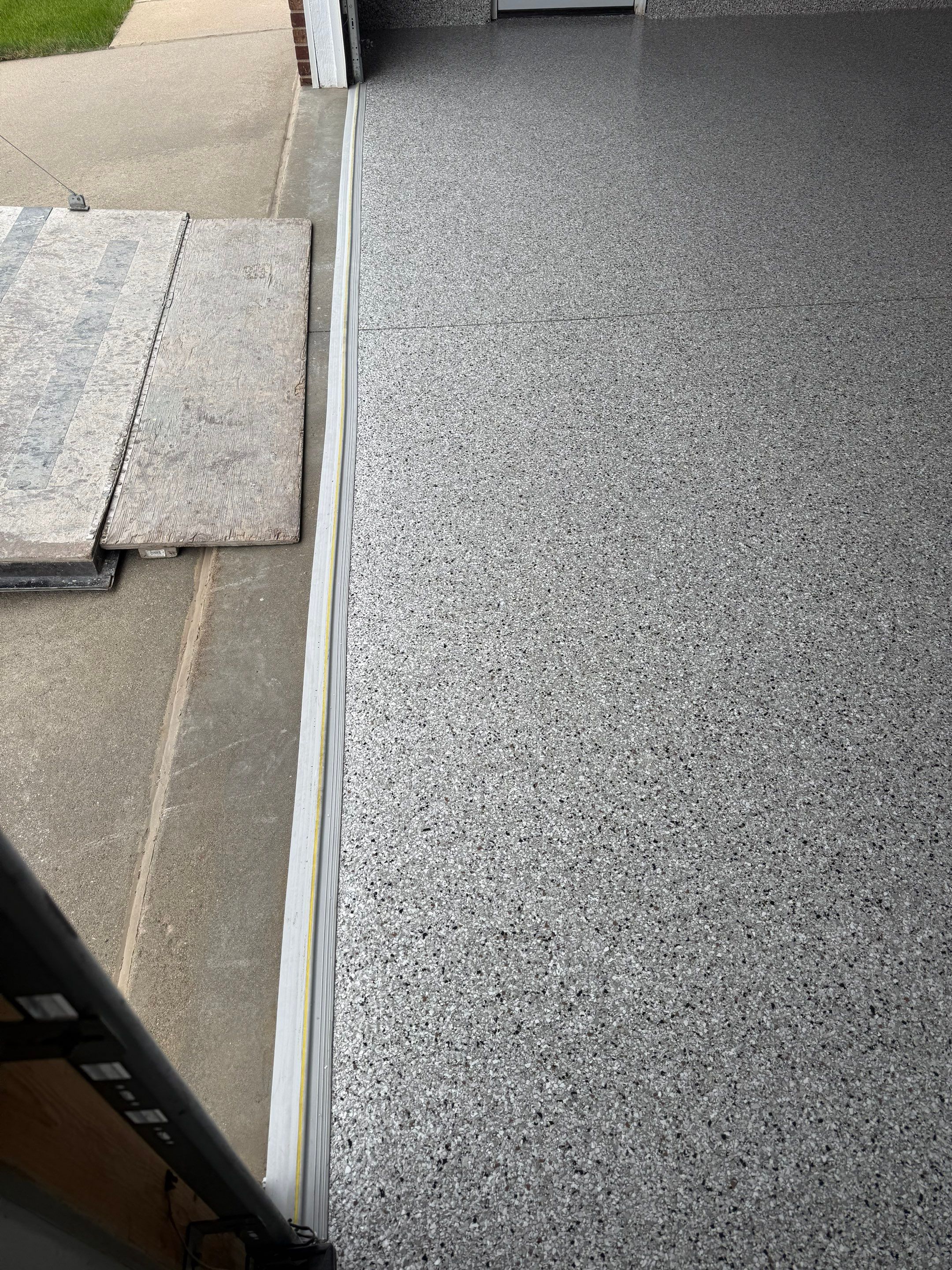 High-Gloss Epoxy Garage Floor Coating in Sioux Falls by Select Painting, Coatings & Garage Cabinets