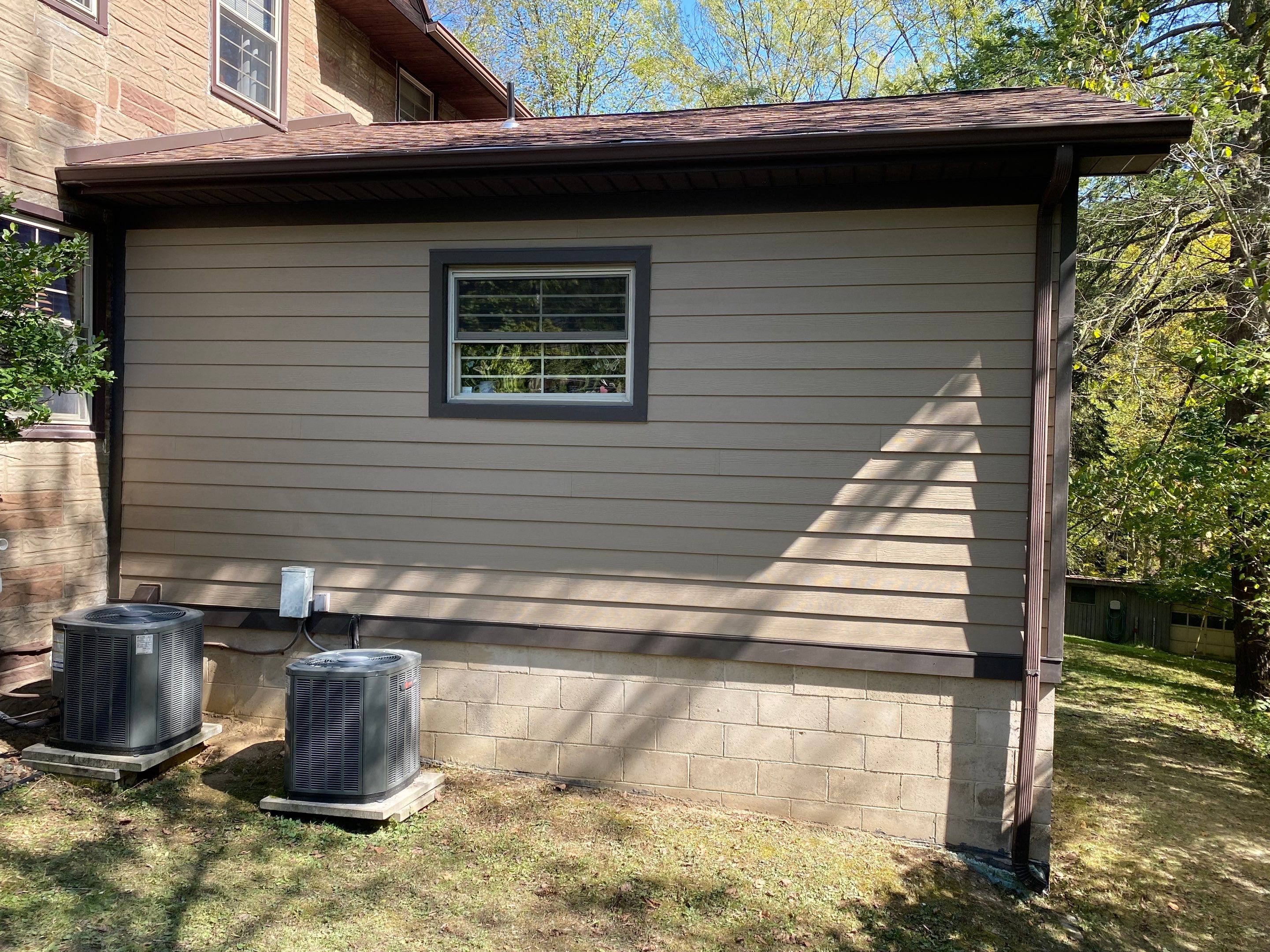 Hardie siding project  by Cousins Roofing Siding & Decks