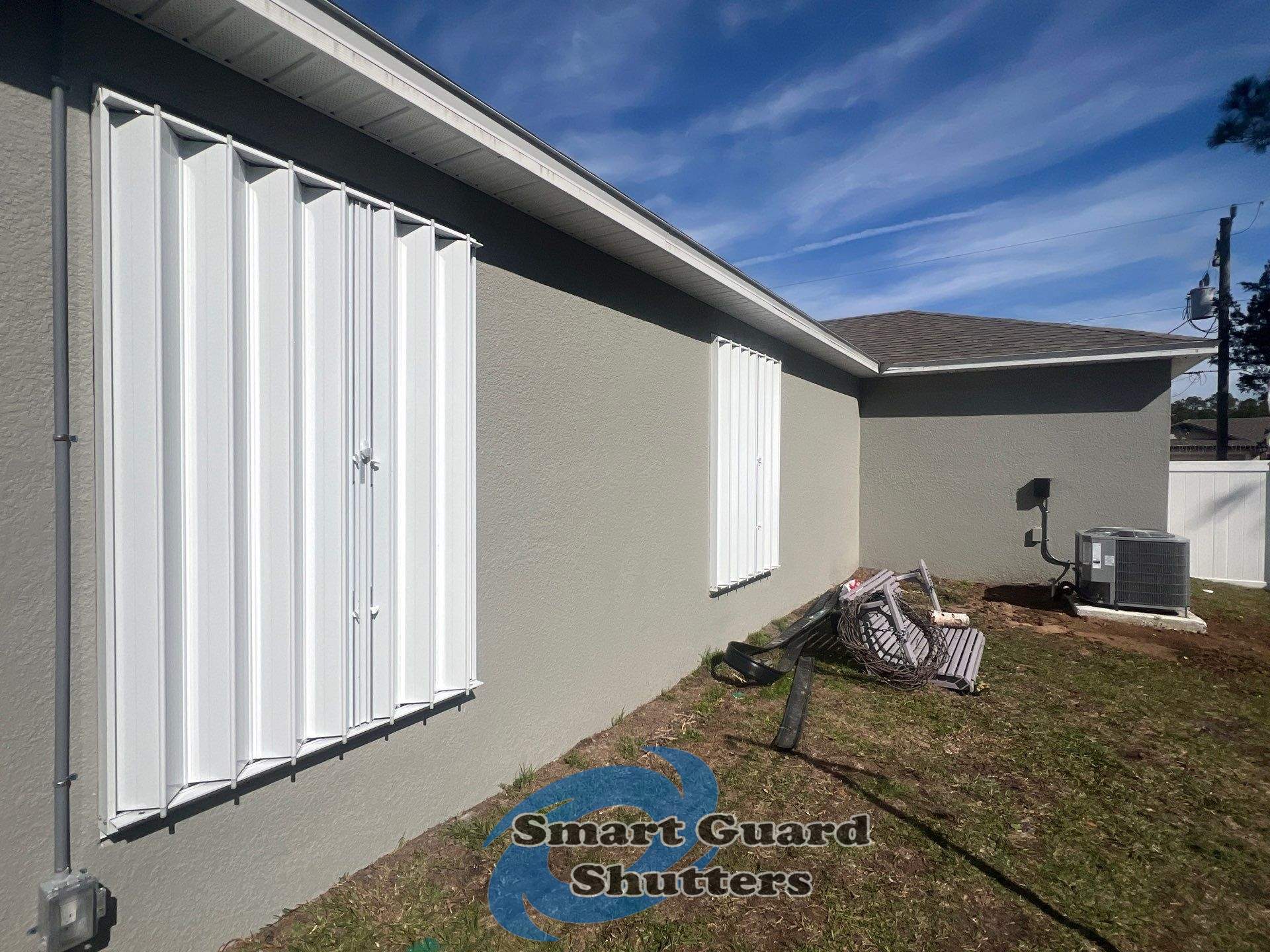 Accordion Shutters in White by Smart Guard Shutters