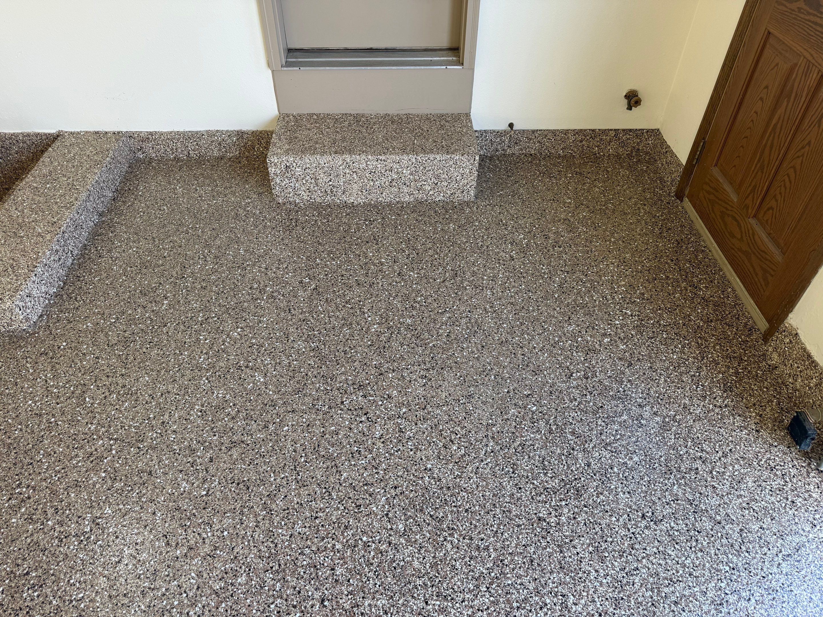 Custom Polyaspartic Garage Floor and Stairwell Coating in Pipestone by Select Painting, Coatings & Garage Cabinets