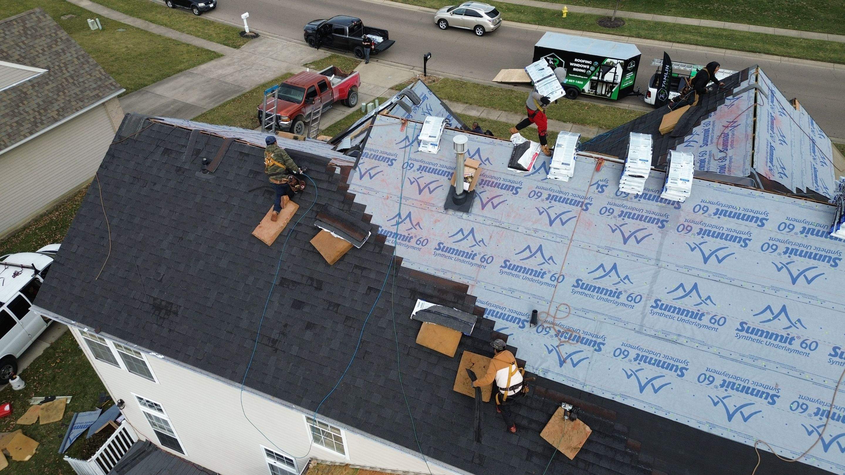 Walden Ponds - Pristine Black and Hydro Flo Gutter Guards by Tamlin Roofing