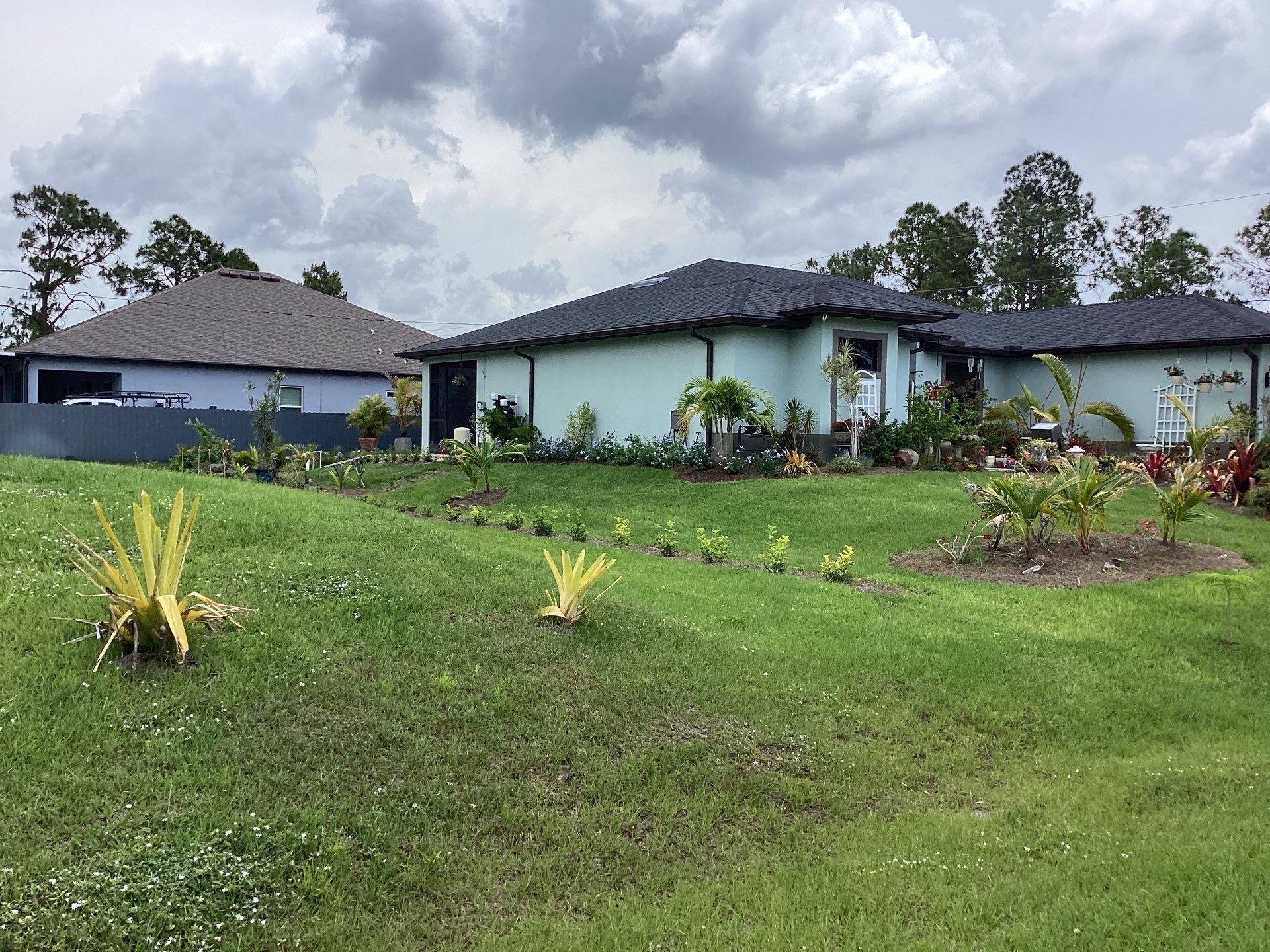 Musket Brown and New Downspouts in Lehigh Acres, FL  by Gutter Professors