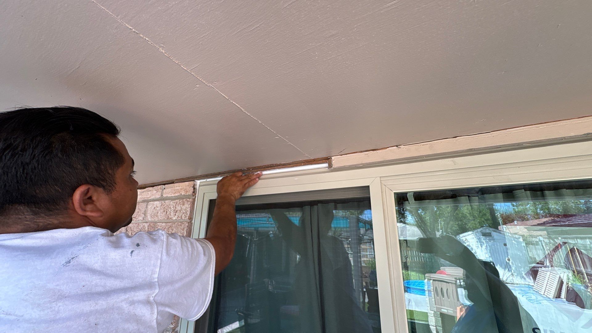 Colored Vinyl Windows to blend into brick by Bayfront Roofing and Construction