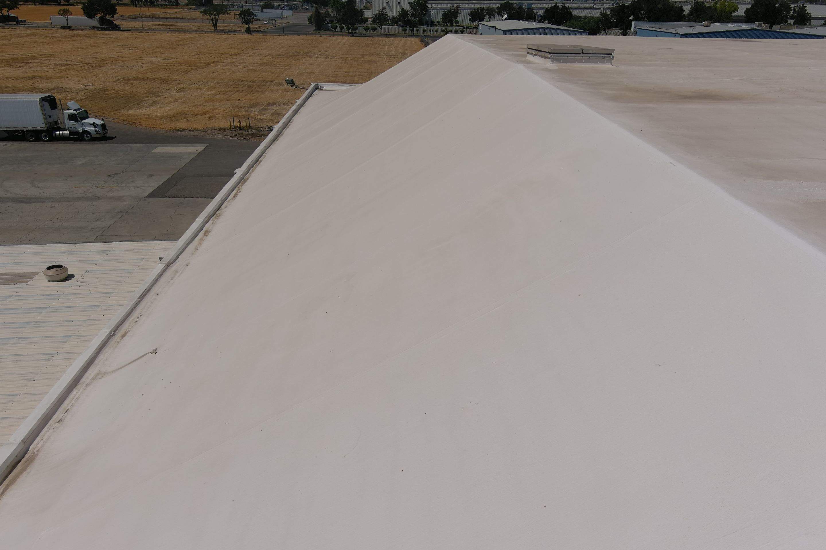 Single-ply restoration system using Conklin Benchmark/PUMA XL fabric and coating by Straight Edge Roofing Inc