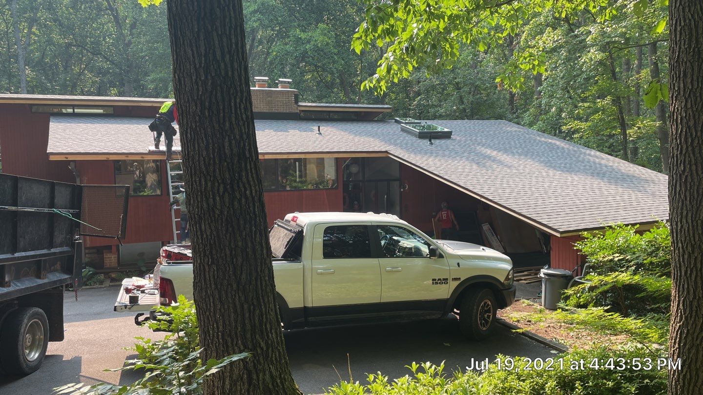 Deckhouse Roof Replacement by American Home Contractors