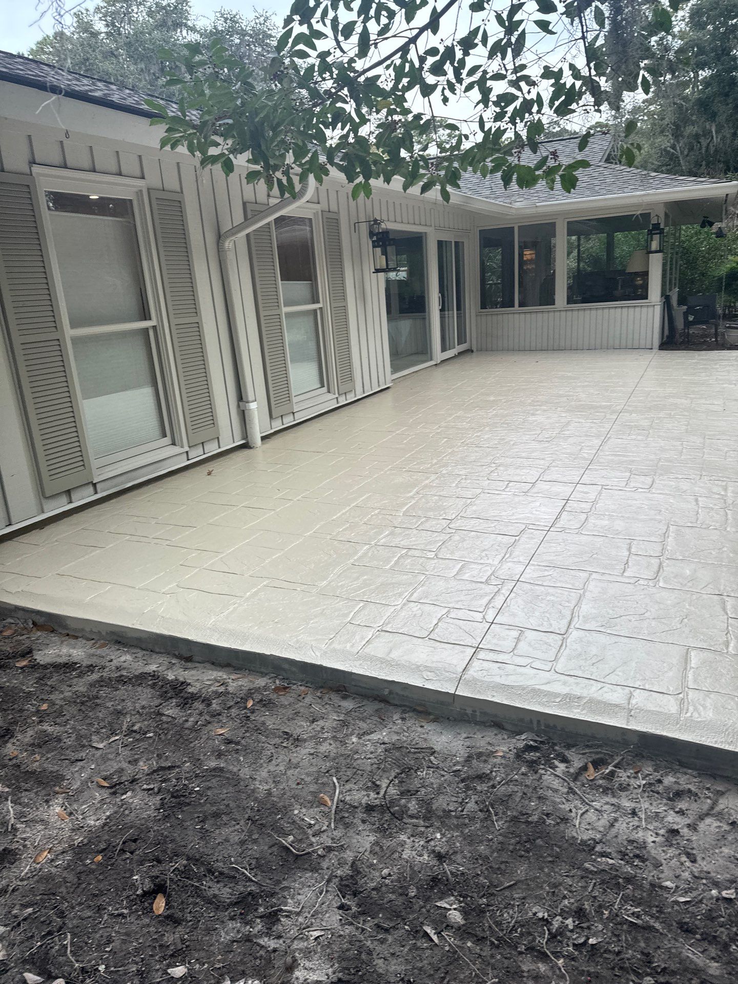 Ashlar Slate Stamped Concrete Patio Installation in Hilton Head Island by Lowcountry Scapes, LLC