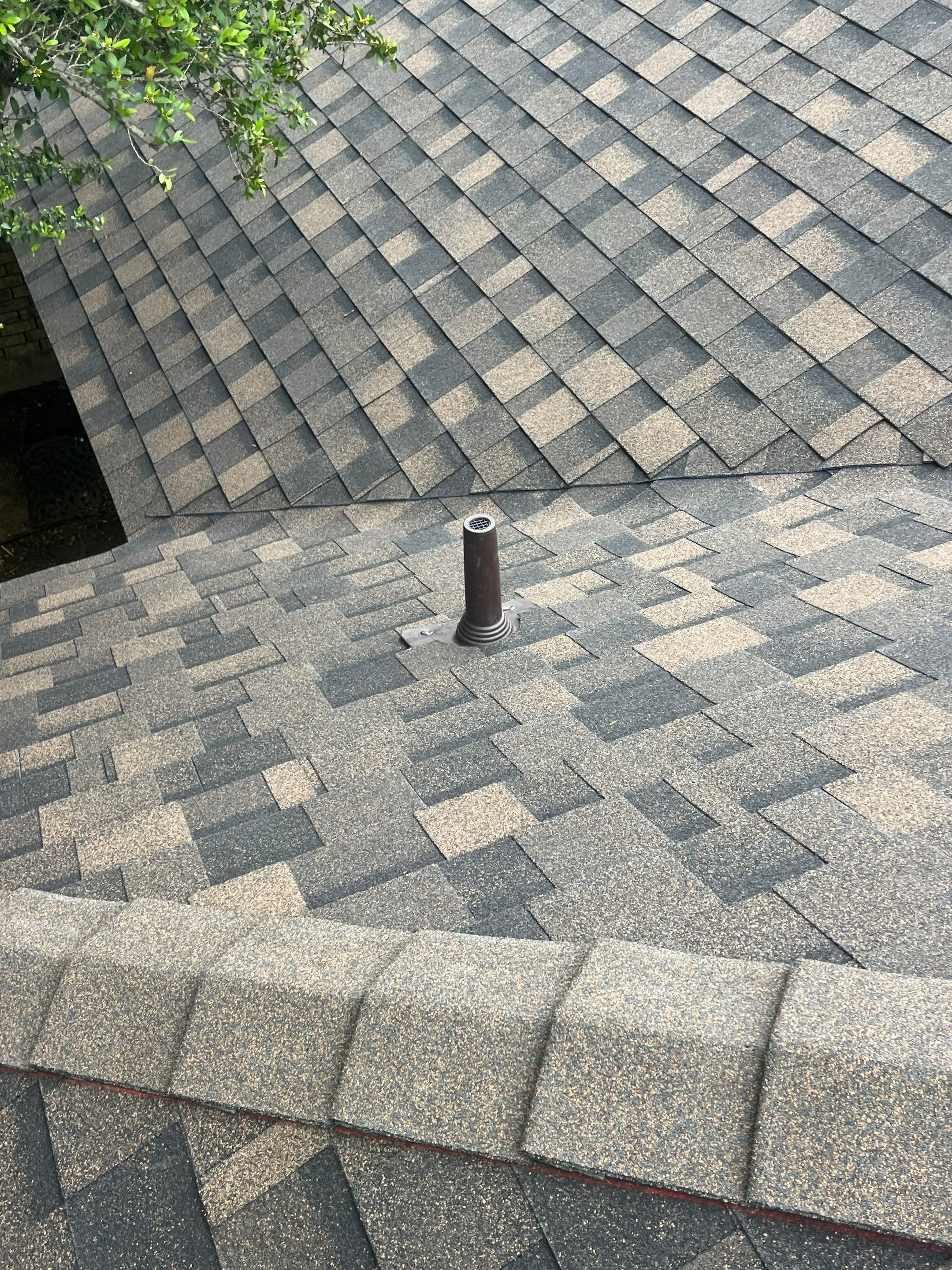 Brown brick with IKO Shadow Brown by Tejas Roofworks + Restoration