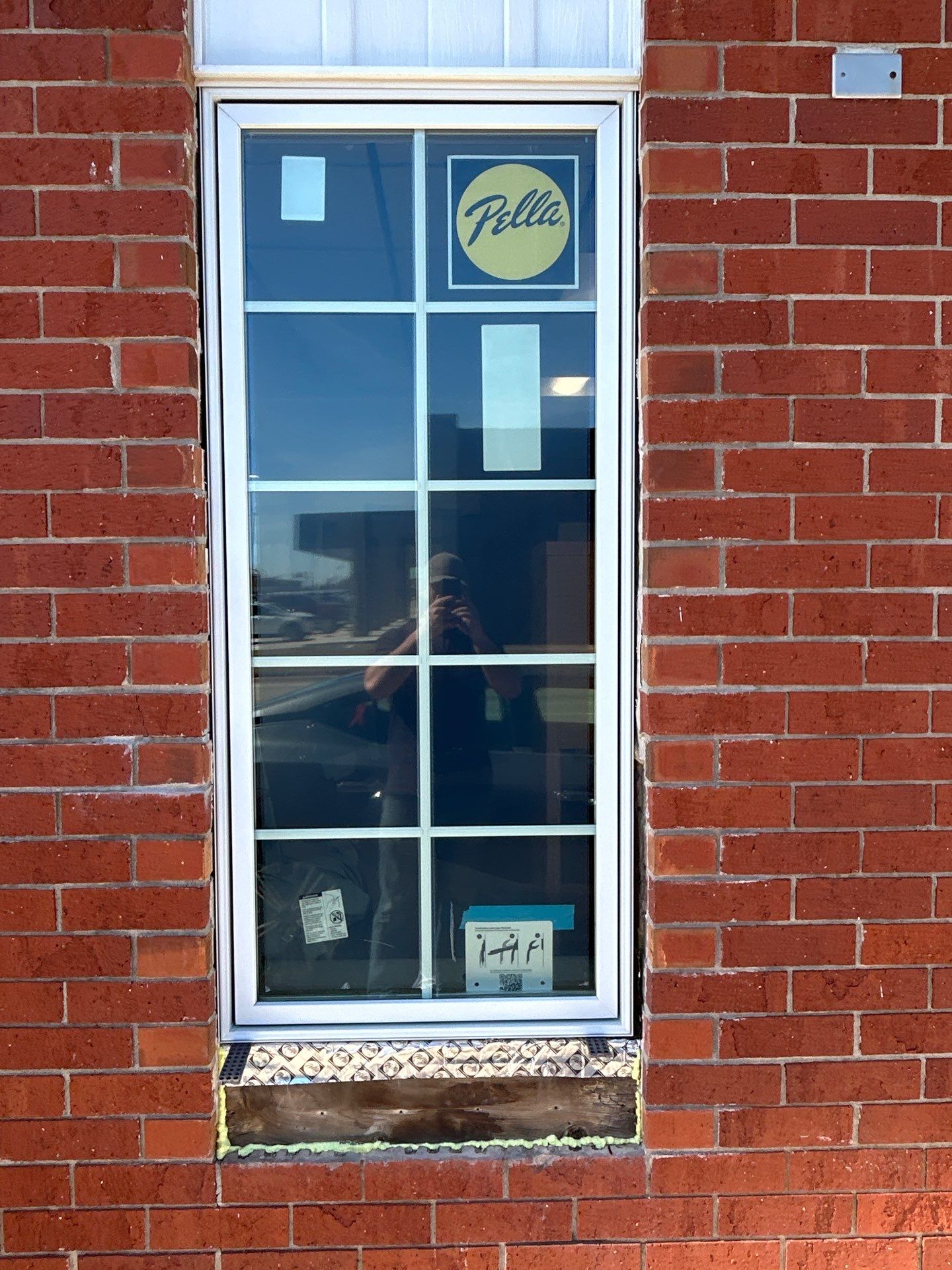 Pella Window installation using Pella Lifestyle wood/Aluminum window by United Windows and Siding LLC