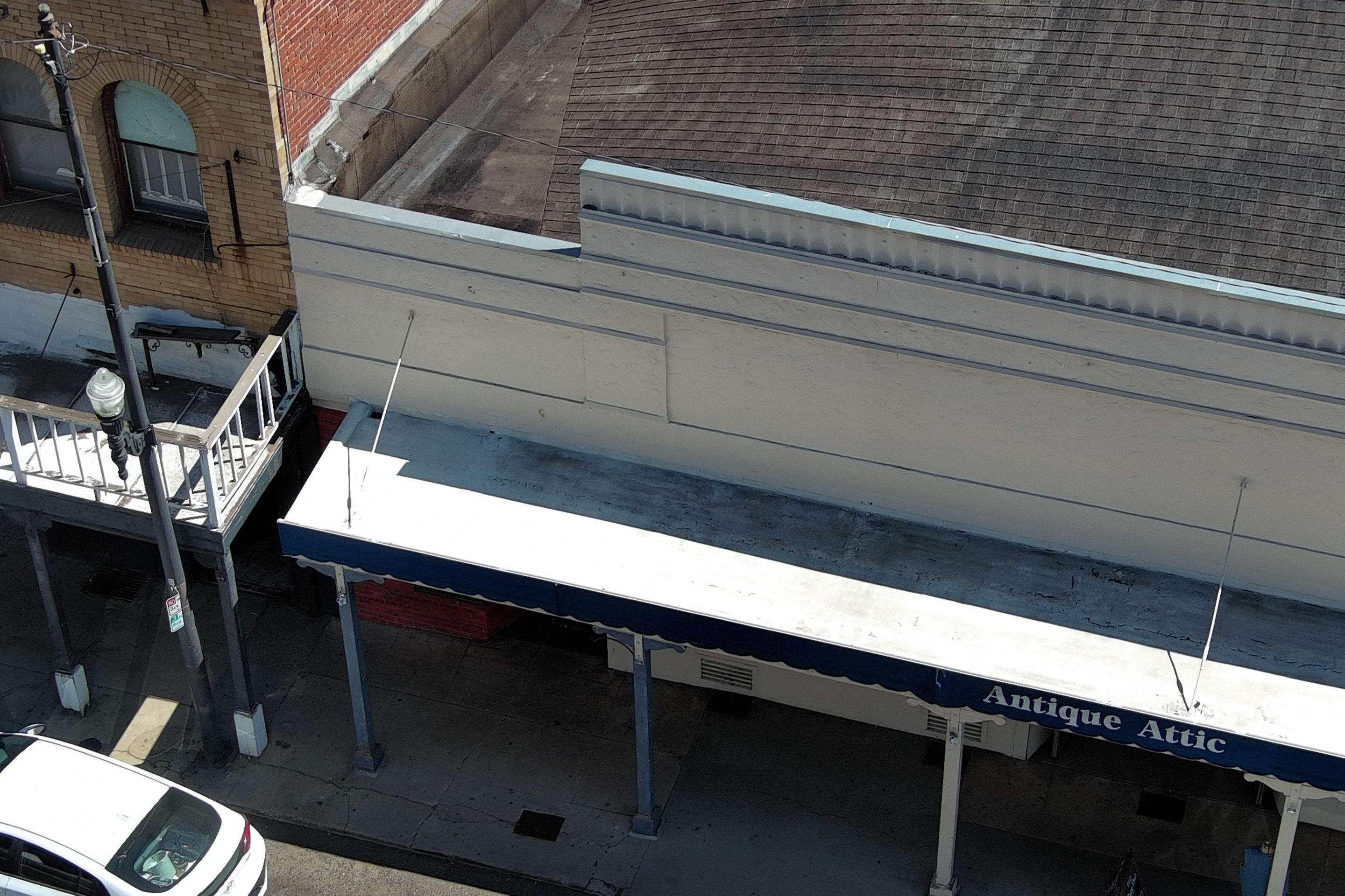 Foam and coatings on commercial roof by Straight Edge Roofing Inc