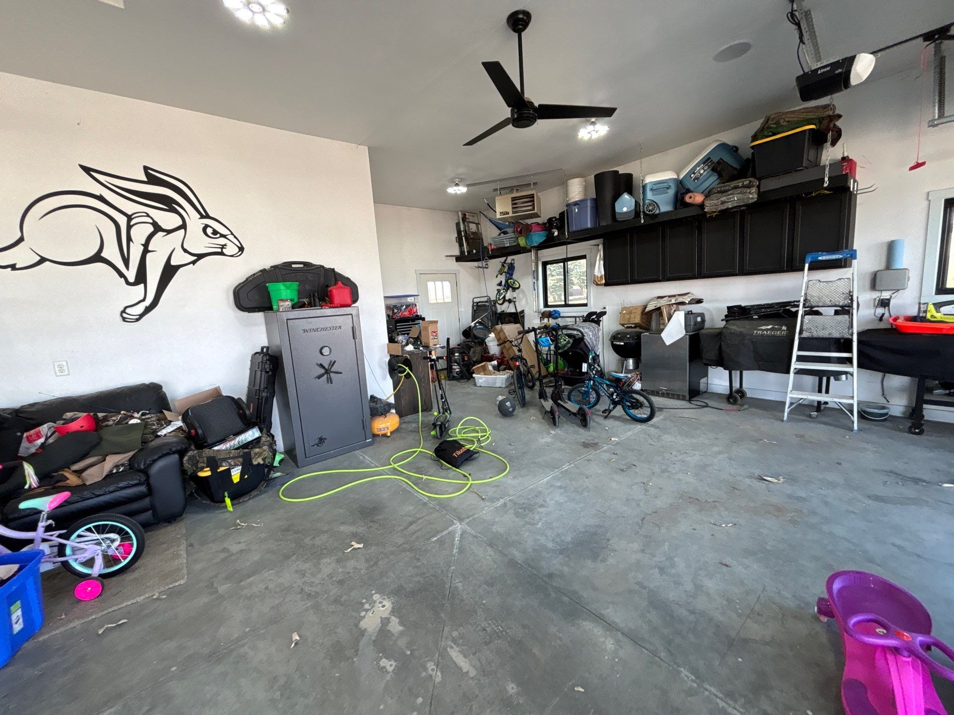Speckled Polyaspartic Garage Floor Coating Installation in Dell Rapids by Select Painting, Coatings & Garage Cabinets