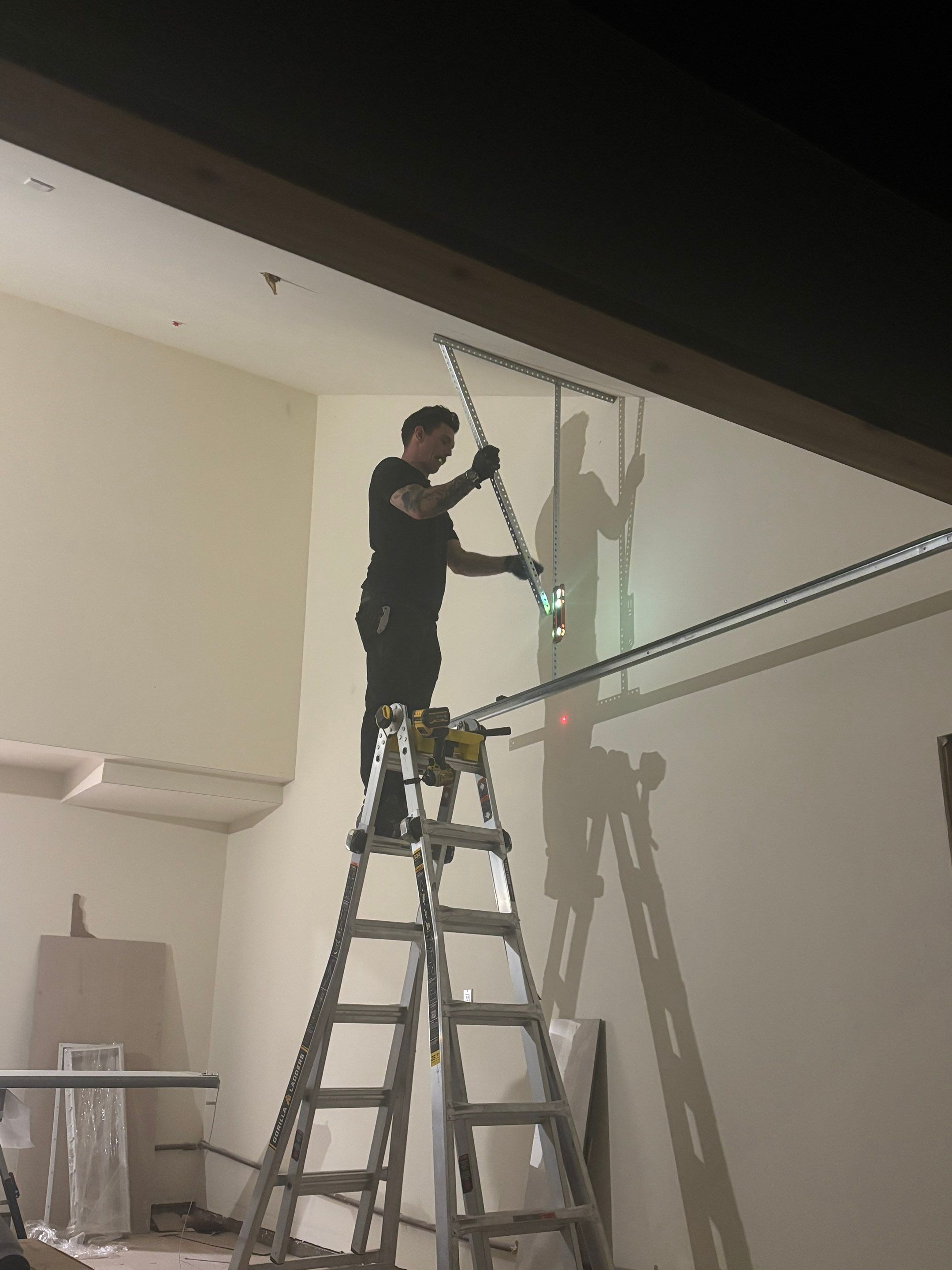 Modern Black Garage Door Installation With Vertical Windows In Cupertino by Valiant Garage Door