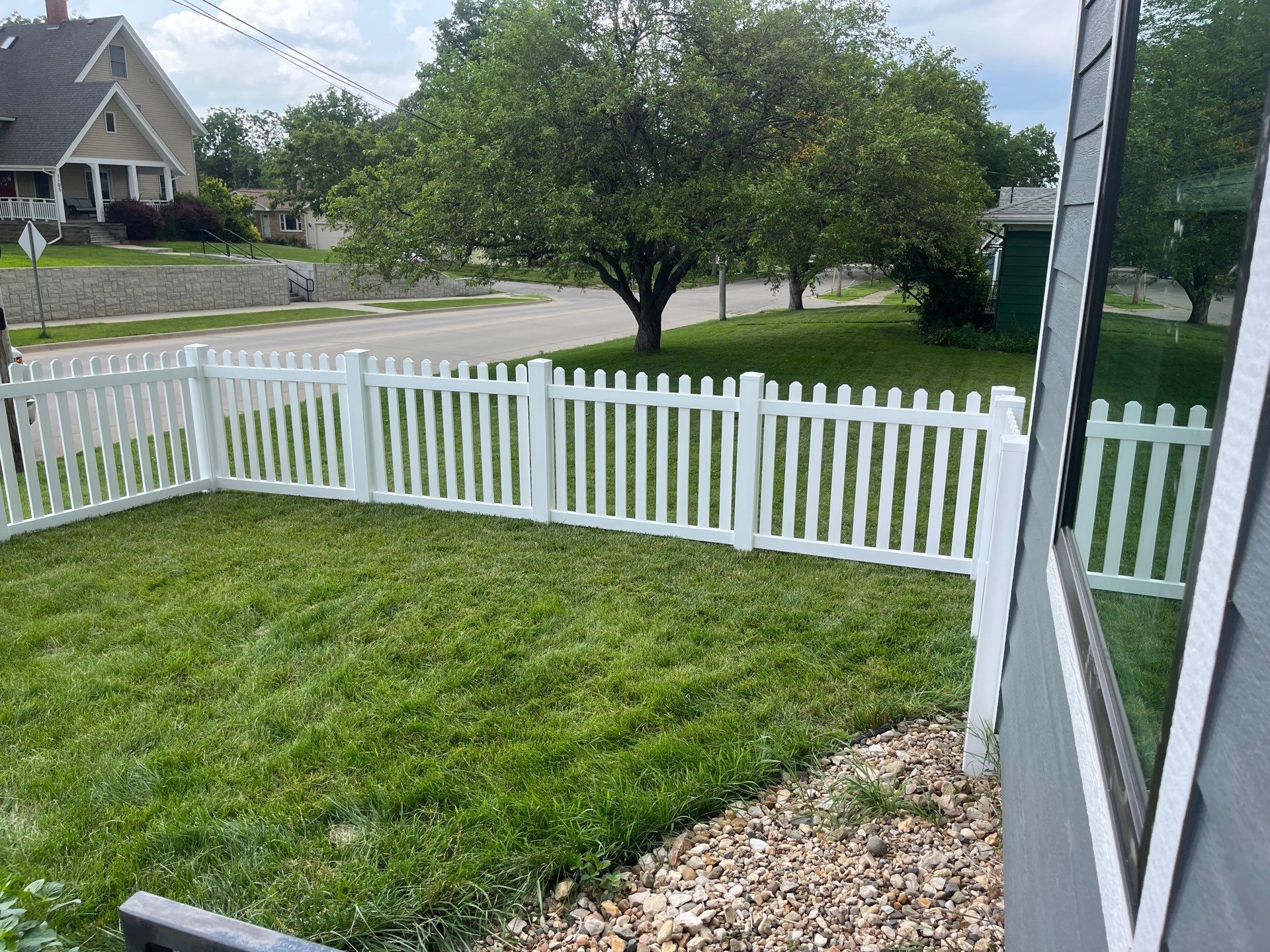 White Vinyl Spaced Picket Fence Installation in Cedar Falls by Perfect Picket Fence and Stain