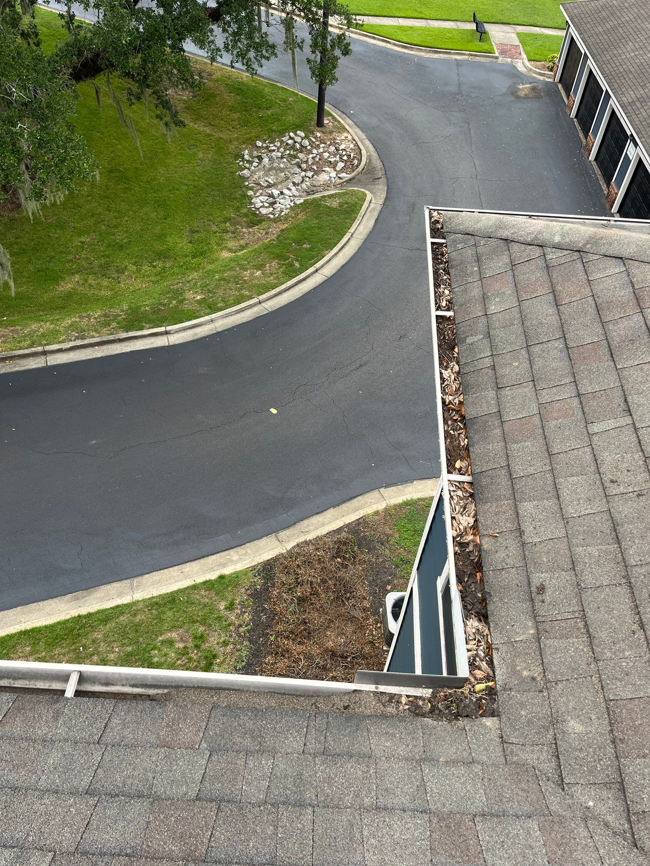 Commercial gutter cleaning Mobile before photo with filled gutters