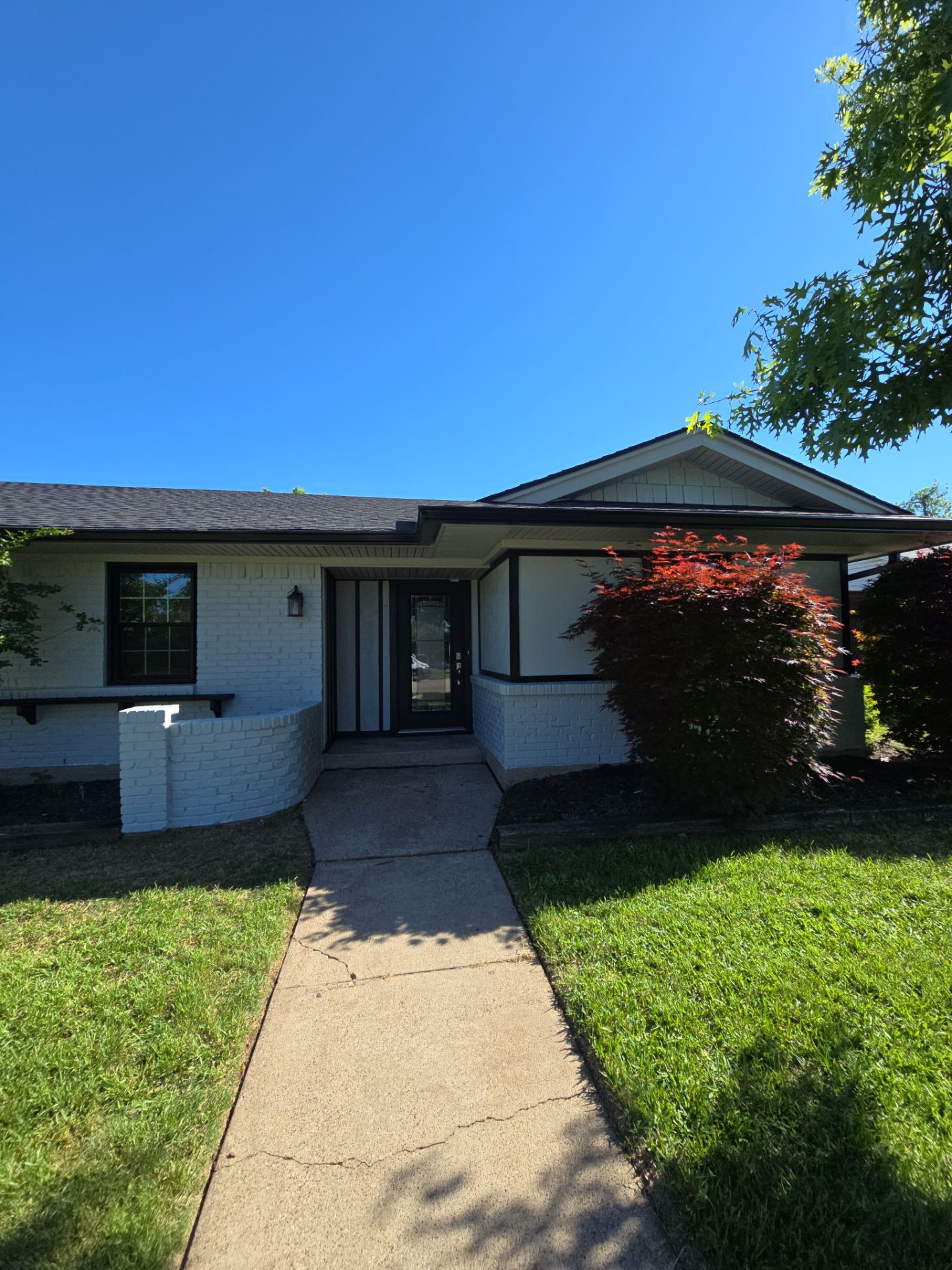 Exterior Home Paint Project with Different Surfaces by SLM General Contractors & Roofing