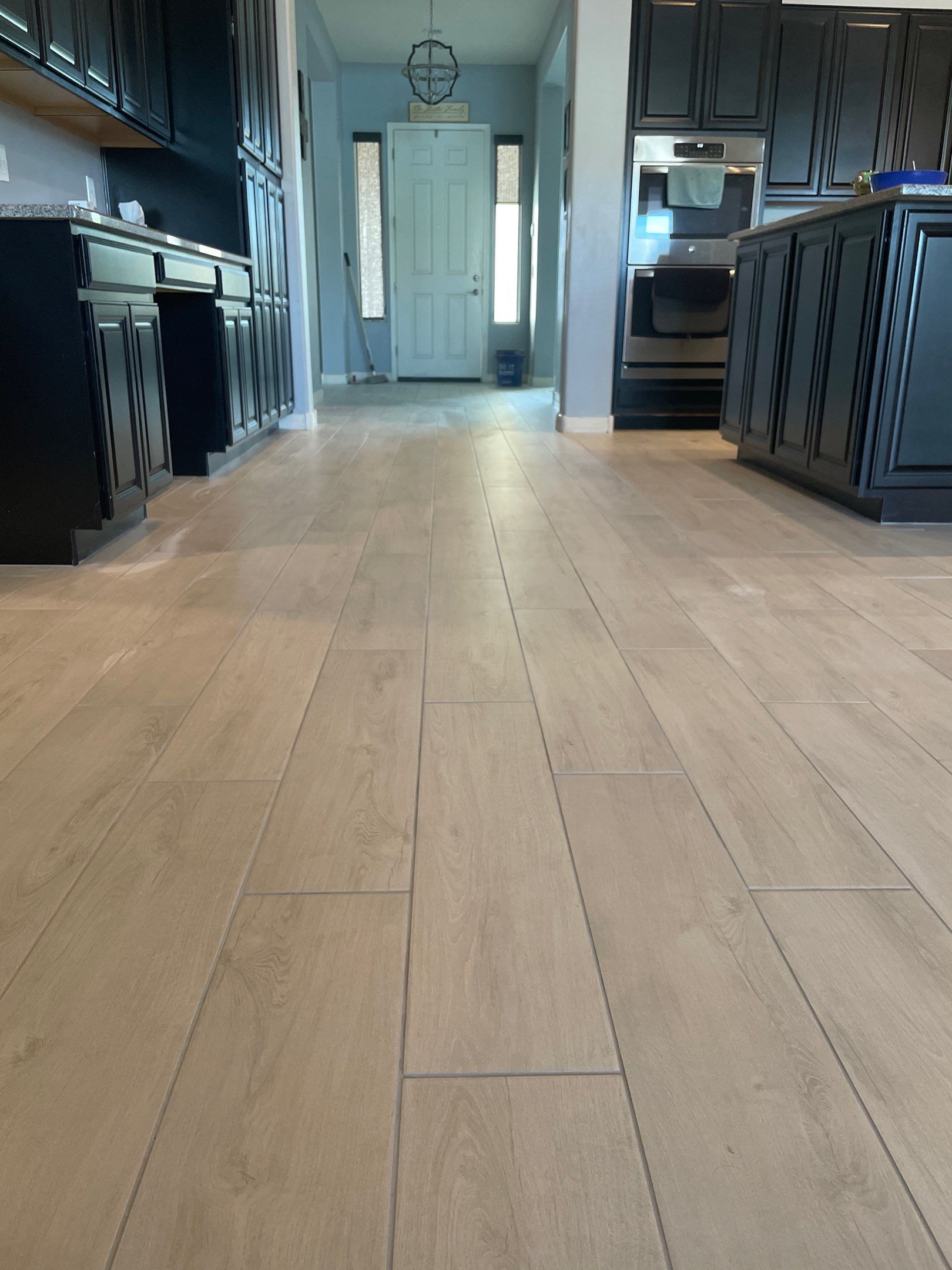 Wood Look Tile Floors and an Extra Large Shower  by Footprints Floors of Chandler 