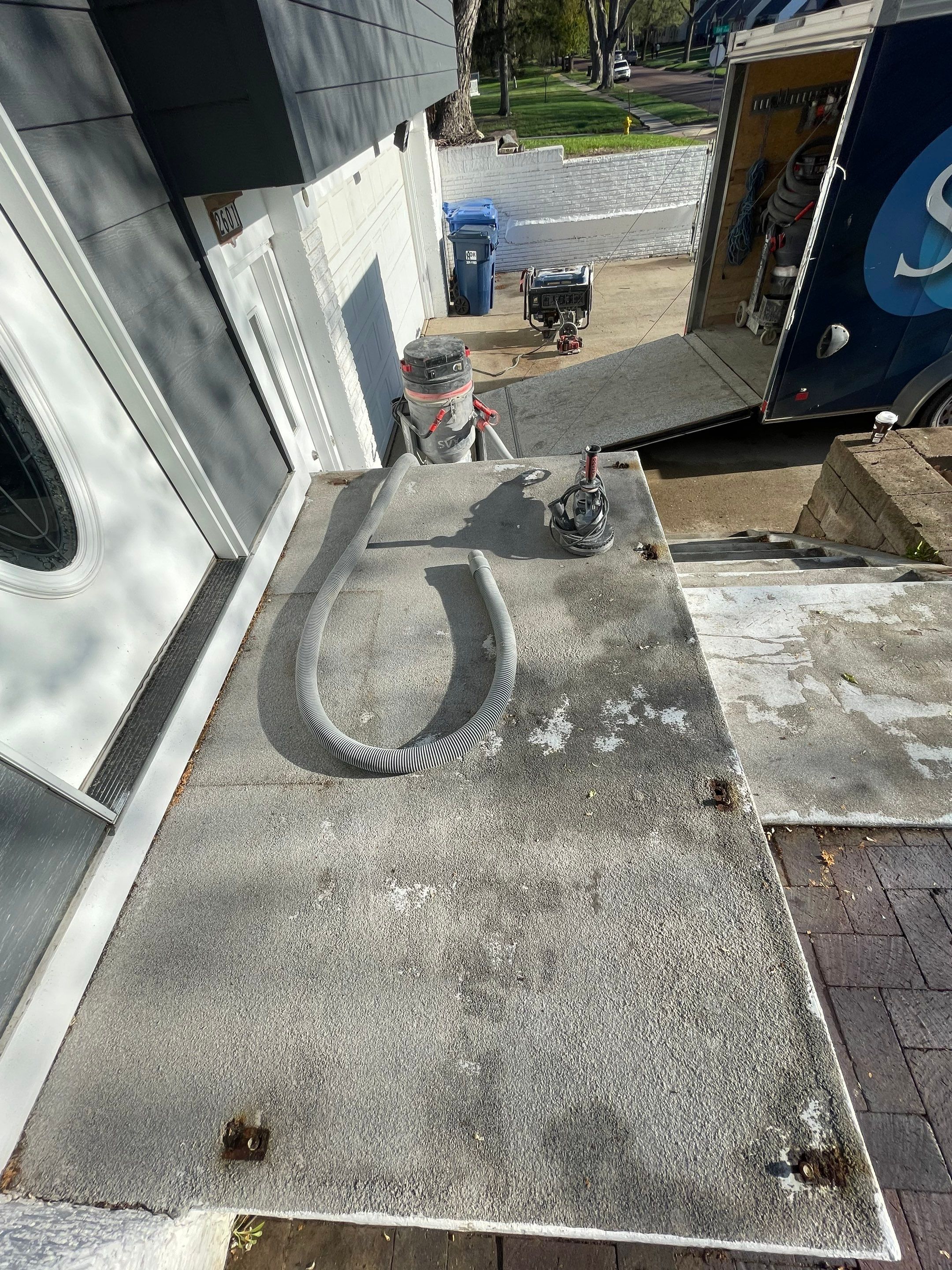 Grey Polyaspartic Porch and Stair Resurfacing in Sioux Falls by Select Painting, Coatings & Garage Cabinets