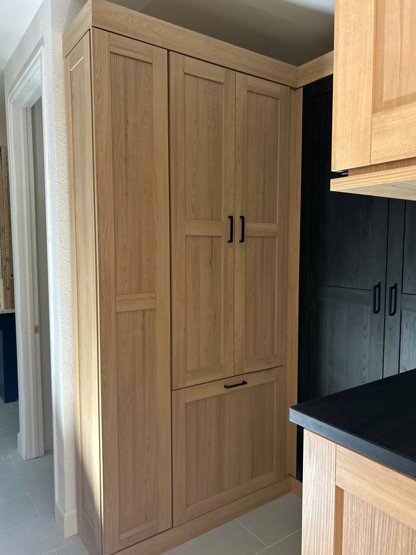 Two-Tone Closet with matching Mudroom + Laundry Room by Concept 32, Inc.
