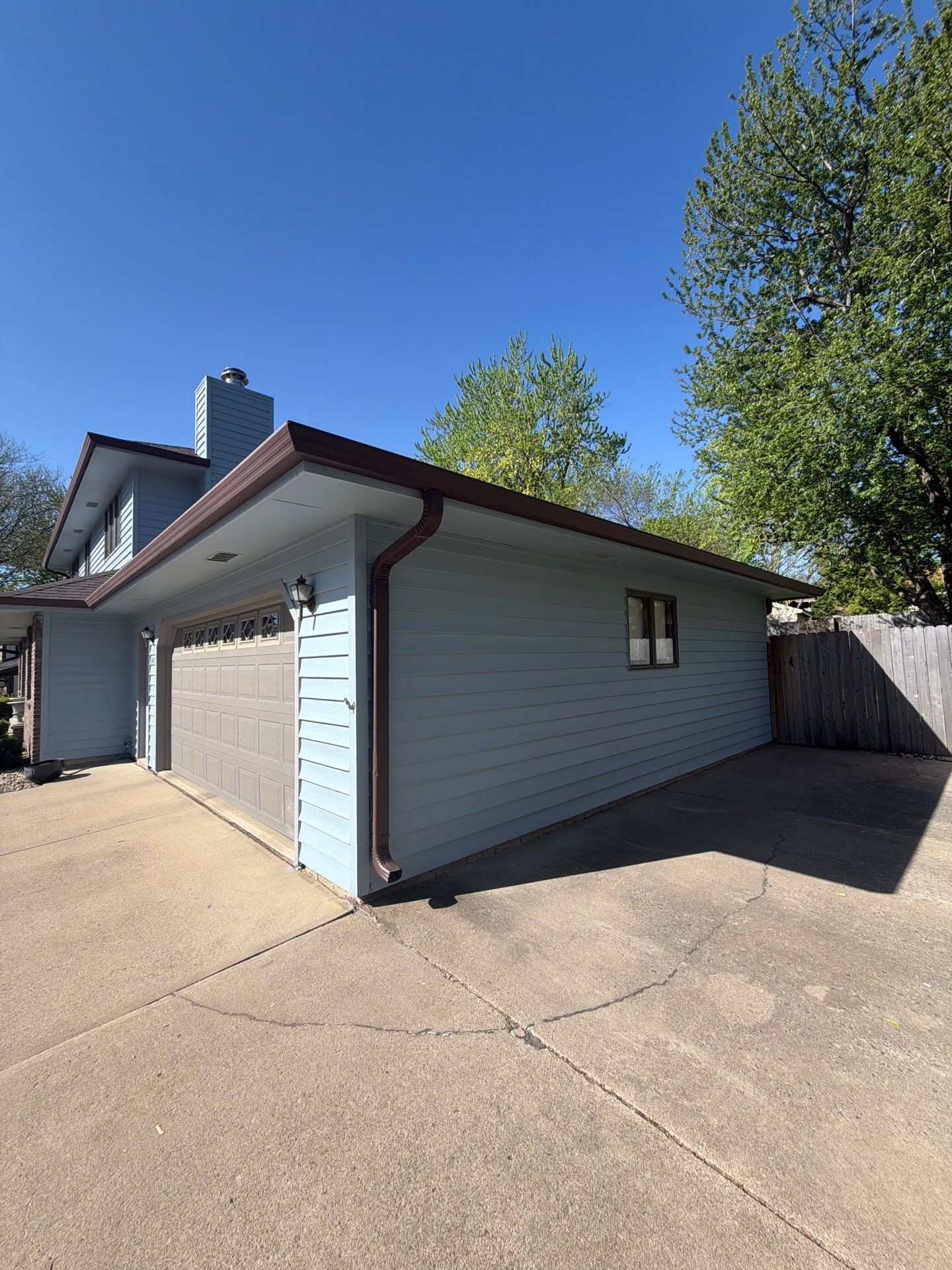 Full Exterior Home Painting and Siding Refurbishment in Sioux Falls by Select Painting, Coatings & Garage Cabinets
