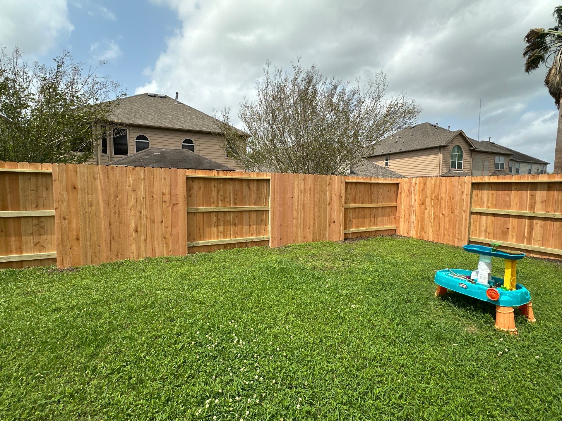 Wood fence with alternating panels by Tim's Fences