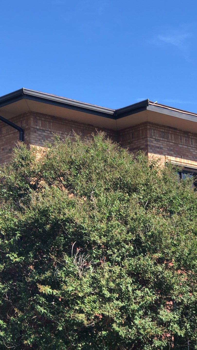 Pensacola Realtor Association Gutter Installation using K-Style White Gutters by Gutter Professors