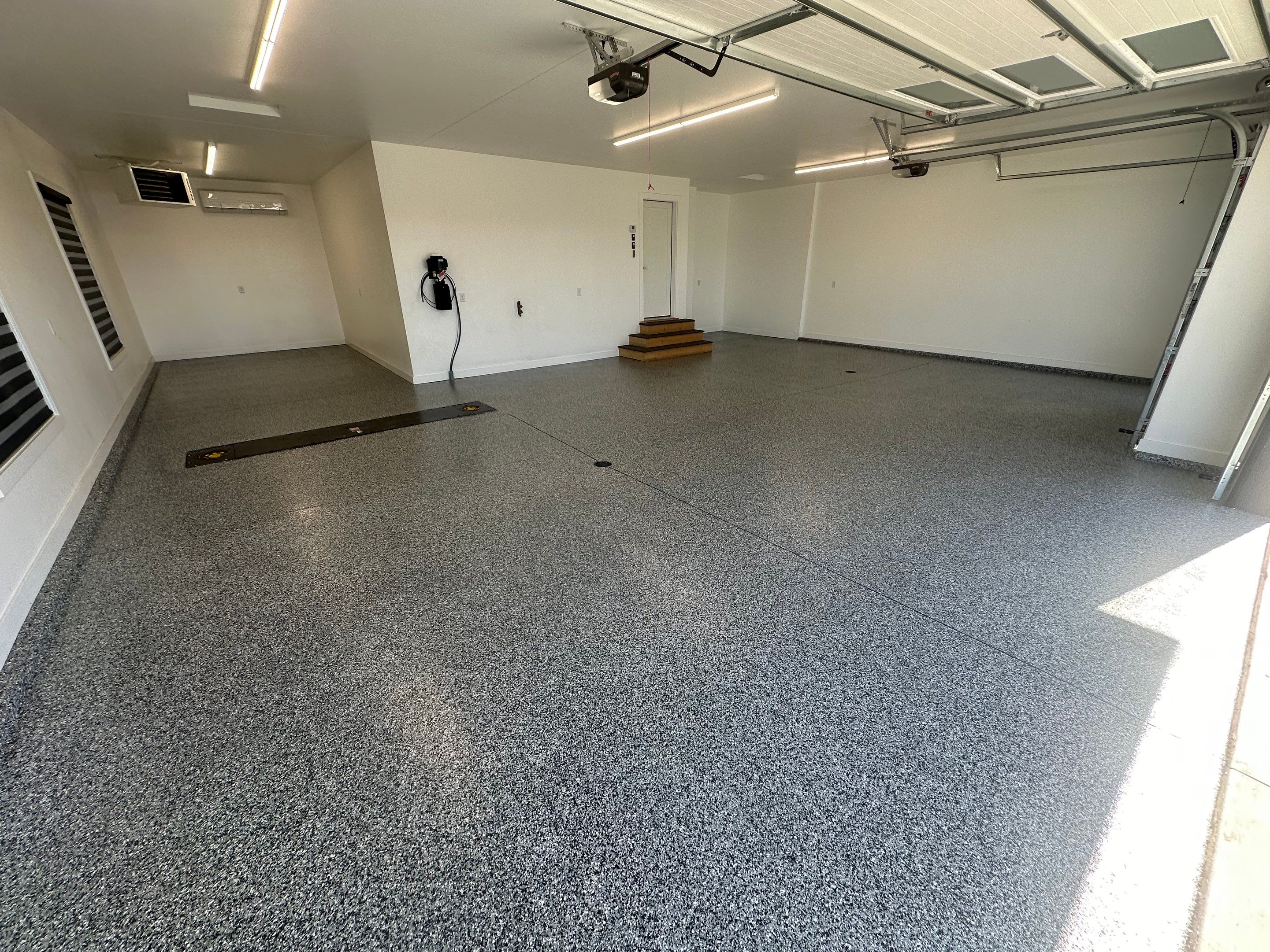 Multi-Color Epoxy Flake Garage Floor Installation in Sioux Falls by Select Painting, Coatings & Garage Cabinets