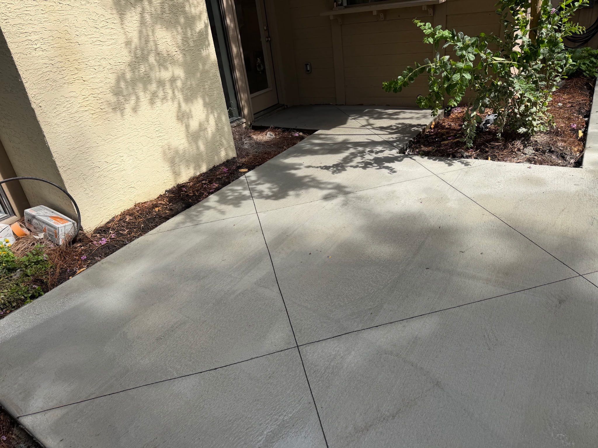 Custom Concrete Patio and Herringbone Paver Walkway in Hilton Head Island by Lowcountry Scapes, LLC